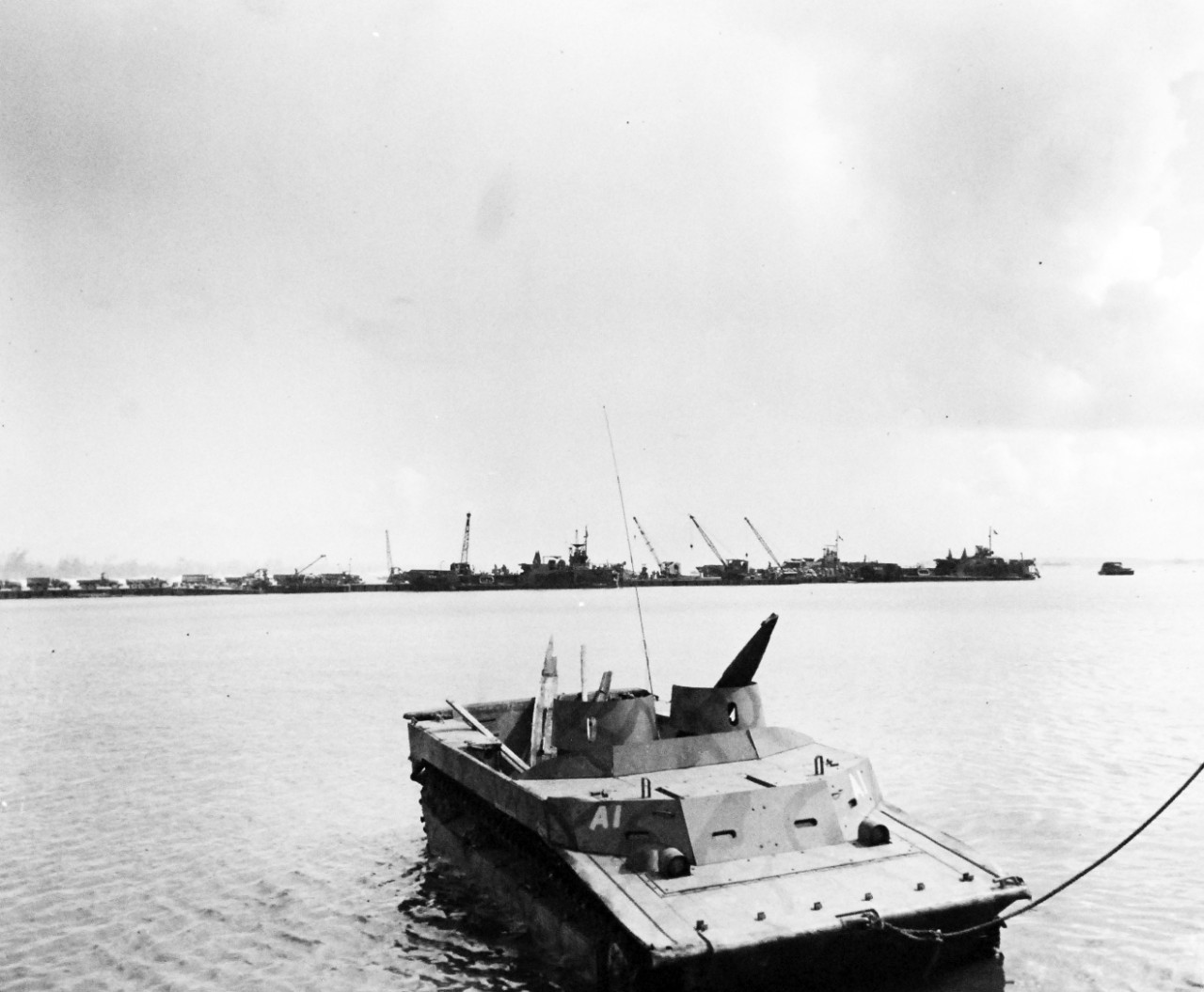 80-G-307736:  Invasion of Saipan, Charon Kanoa, June-July 1944.  U.S. pier at Charon Kanoa, Saipan, with an LVT in foreground.   Photograph received March 20, 1945.      Official U.S. Navy Photograph, now in the collections of the U.S. Navy.  (2017/04/11).  