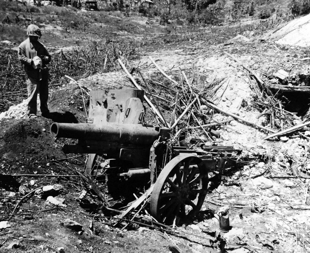 80-G-307744:  Invasion of Saipan, June-July 1944.  Japanese guns captured on Saipan after invasion.  Shown: Howitzer.  Photograph received March 20, 1945.      Official U.S. Navy Photograph, now in the collections of the U.S. Navy.  (2017/04/11).  