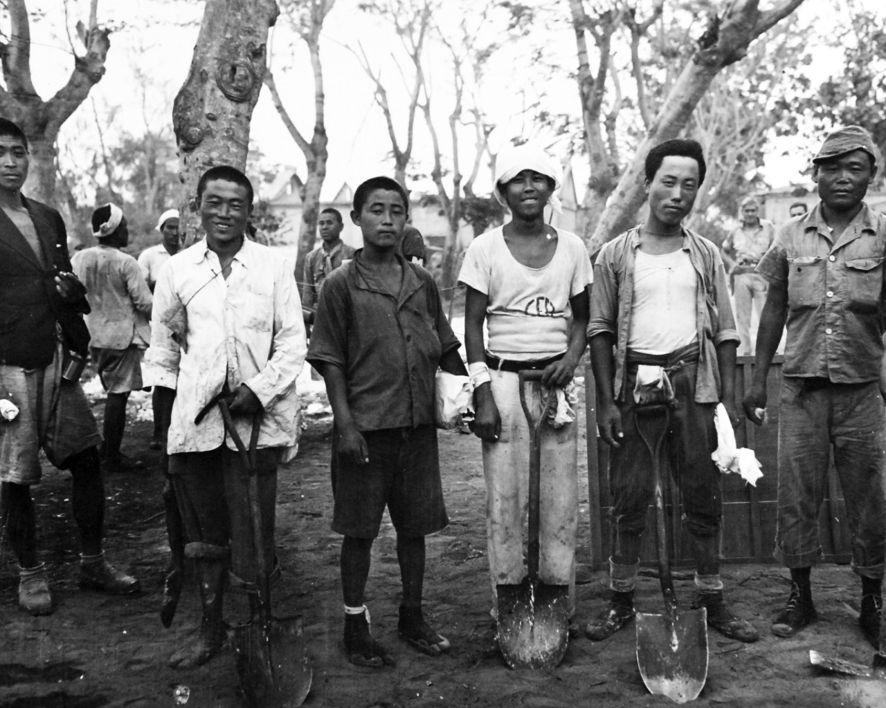 80-G-307792:  Invasion of Saipan, June-July 1944.  Native boys of Saipan help with repairing and building of roads after invasion operations.   Photograph received March 20, 1945.      Official U.S. Navy Photograph, now in the collections of the U.S. Navy.  (2017/04/11).  