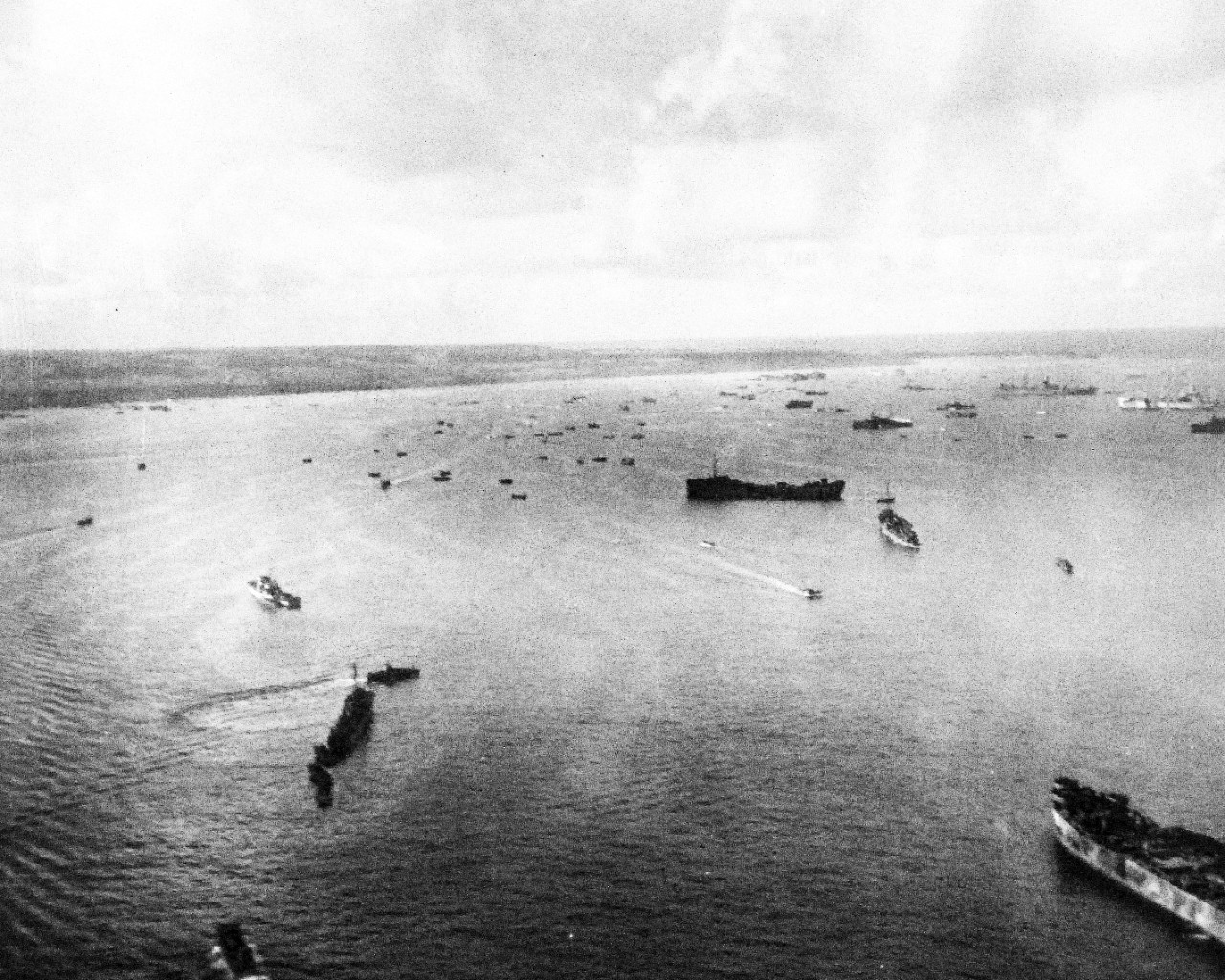 80-G-384139:   Invasion of Saipain, June-July 1944.  Aerials of Saipan Island.  Taken by plane from USS White Plains (CVE 66), June 24, 1944.   Official U.S. Navy Photograph, now in the collection of the National Archives.   (2015/3/4).