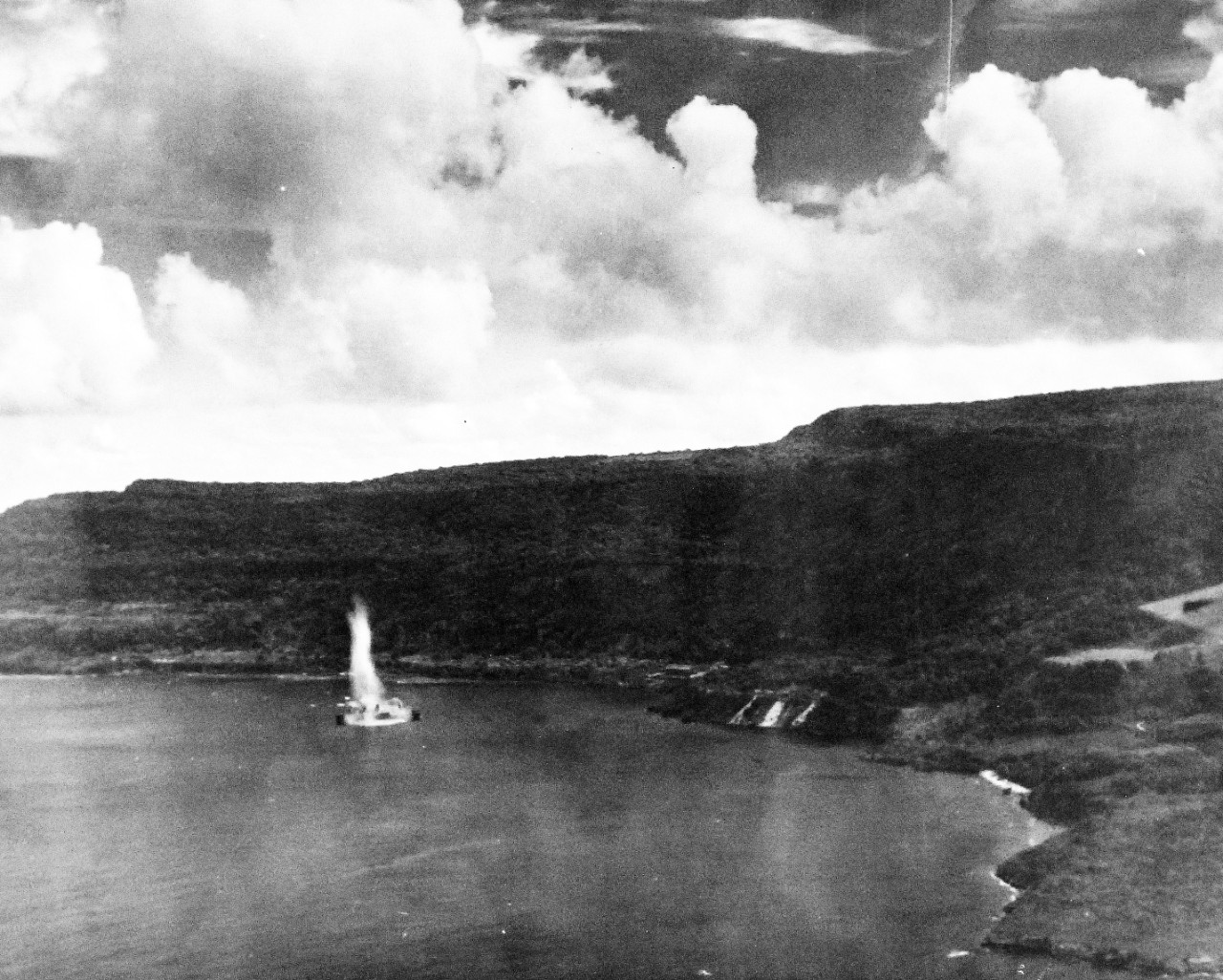 80-G-384151:   Invasion of Saipain, June-July 1944.   Sinking of Japanese transport off Rota Island, Mariana Islands.  Photographed by plane from USS White Plains (CE 66), June 24, 1944.  Official U.S. Navy Photograph, now in the collection of the National Archives.   (2015/3/4).