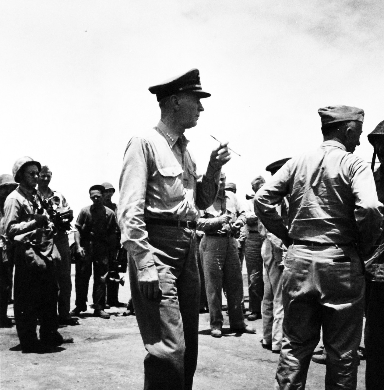 80-G-475148:  Invasion of Saipan, June-July 1944.  Admiral Ernest J. King, Commander-in-Chief of U.S. Fleet, inspects airfield on Saipan.  Photographed by Lieutenant Paul Dorsey, July 1944, TR-10225.      Official U.S. Navy photograph, now in the collections of the National Archives.   (2017/03/15).