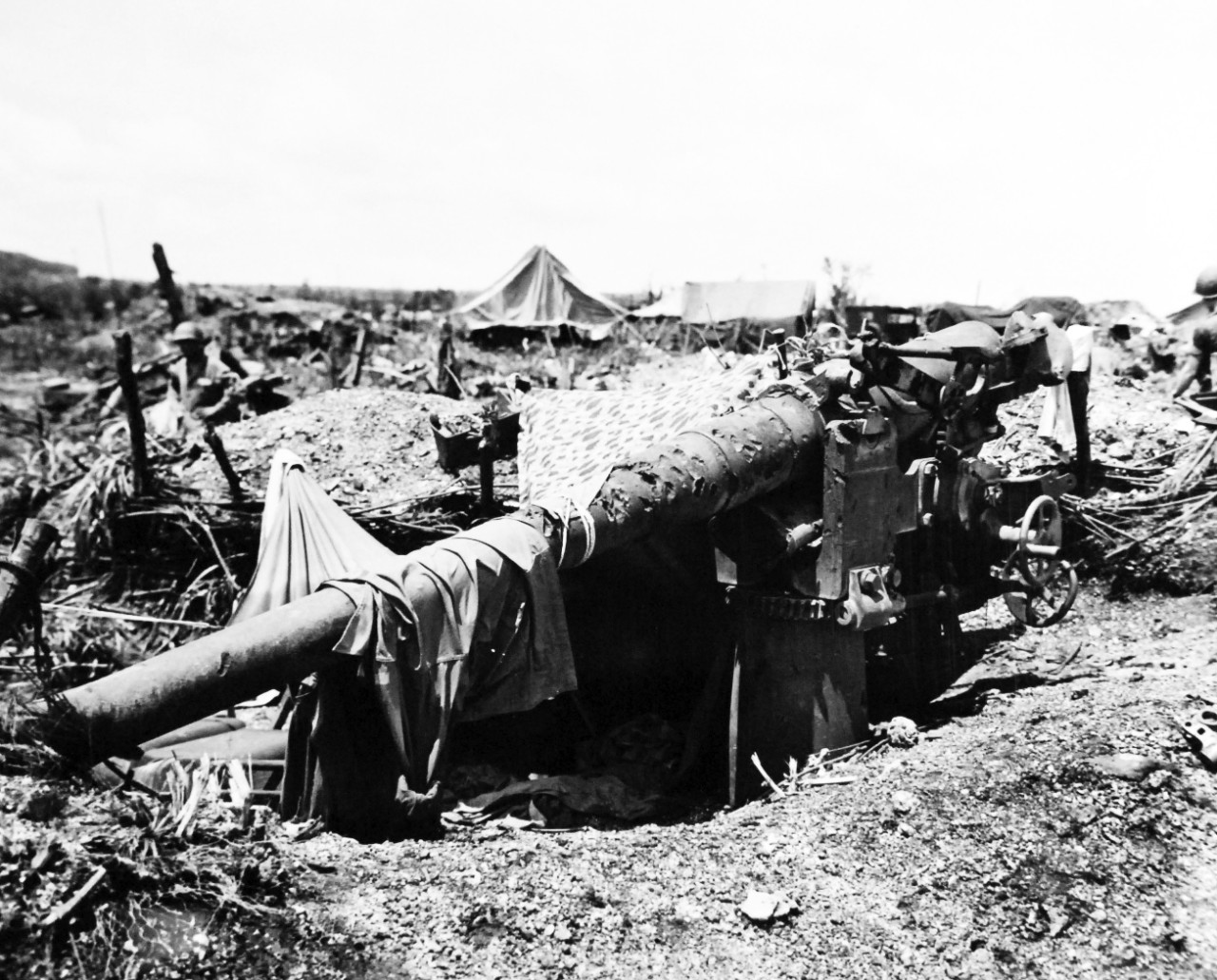 80-G-307884:  Invasion of Tinian, July-August 1944.   Japanese guns captured on Tinian.  Six-inch coastal defense gun.  Photograph received March 20, 1945.      Official U.S. Navy photograph, now in the collections of the U.S. Navy.  (2017/04/11).  