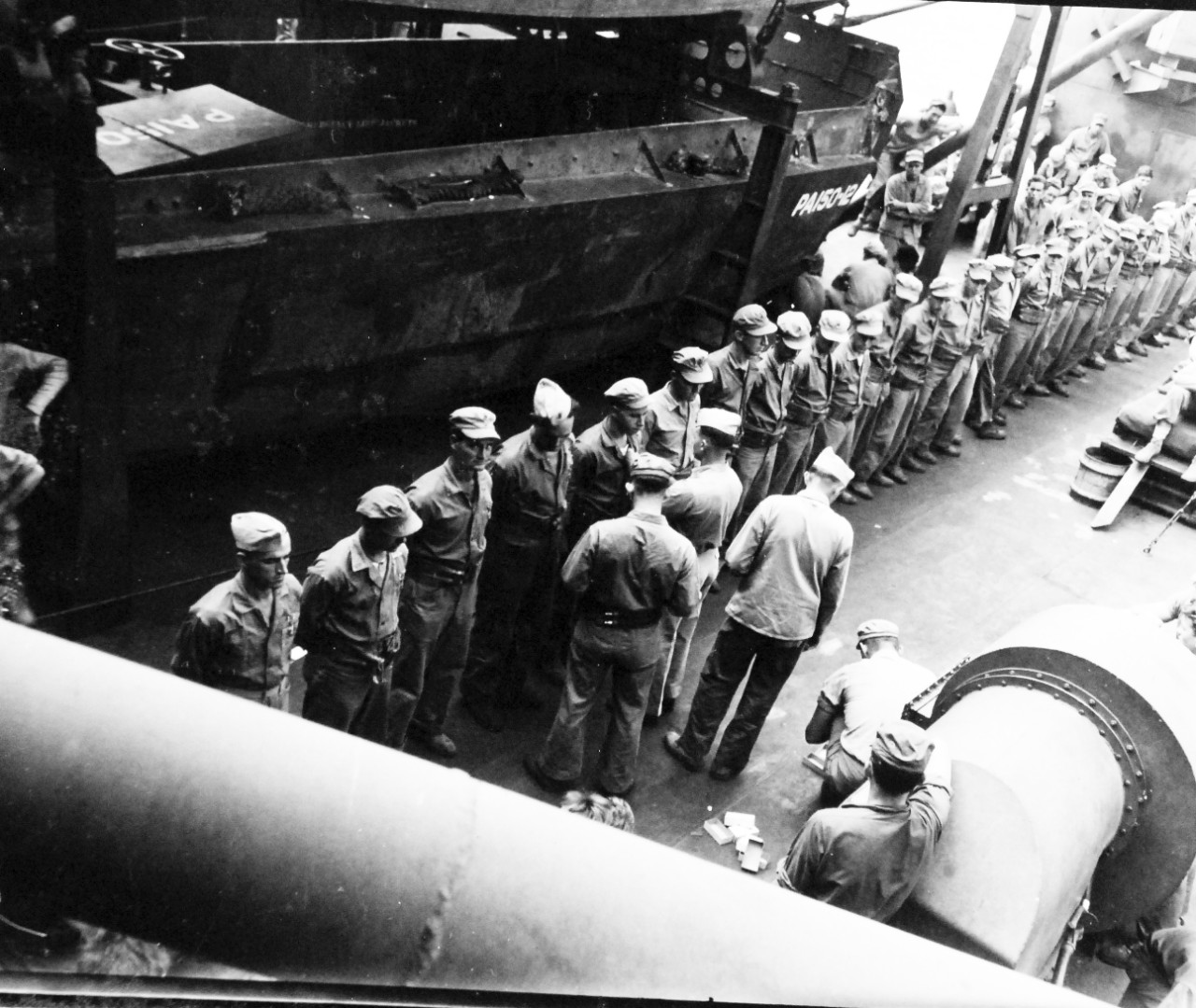 127-GW-224-225169:  Okinawa Campaign, Purple-Hearts, September 30, 1945.    USS Bergen (APA-150).   Captain Morse L. Halladay pins a Purple Heart on a Marine for wounds suffered on Okinawa.   Awards were given en-route to China.   Photographed by Huntington, September 30, 1945.  Official U.S. Marine Corps Photograph, now in the collection of the National Archives.  (2015/5/5). 