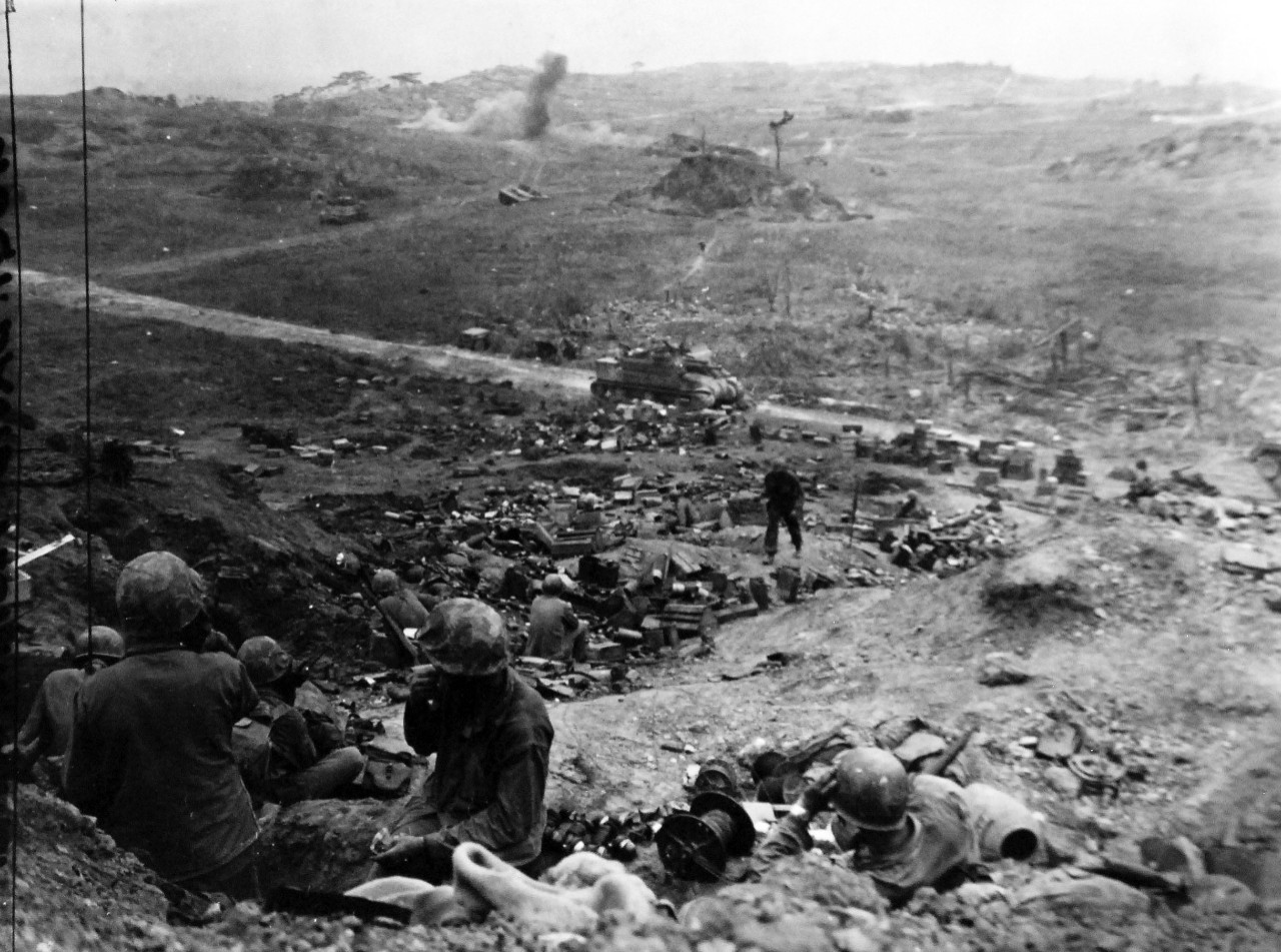 127-GW-518-122265:  Okinawa Campaign, April-June 1945.    Scene from Sugar Loaf Hill.  Enemy shells bursting in the background, Okinawa.   Photographed by Peskin, 23 May 1945.   Official U.S. Navy Photograph, now in the collections of the National Archives.   (2014/6/25). 