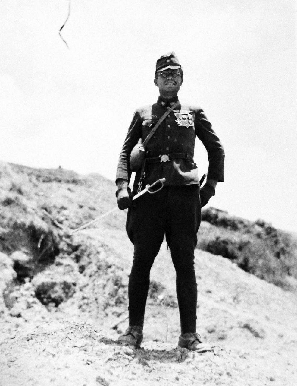 127-GW-535-128868:  Okinawa Campaign, April-June 1945.   Corporal John A. Tillotson, USMC, poses in a Japanese uniform found on Okinawa.   Photographed by McElroy, 19 June 1945.  Official U.S. Navy Photograph, now in the collections of the National Archives.   (2014/6/25). 