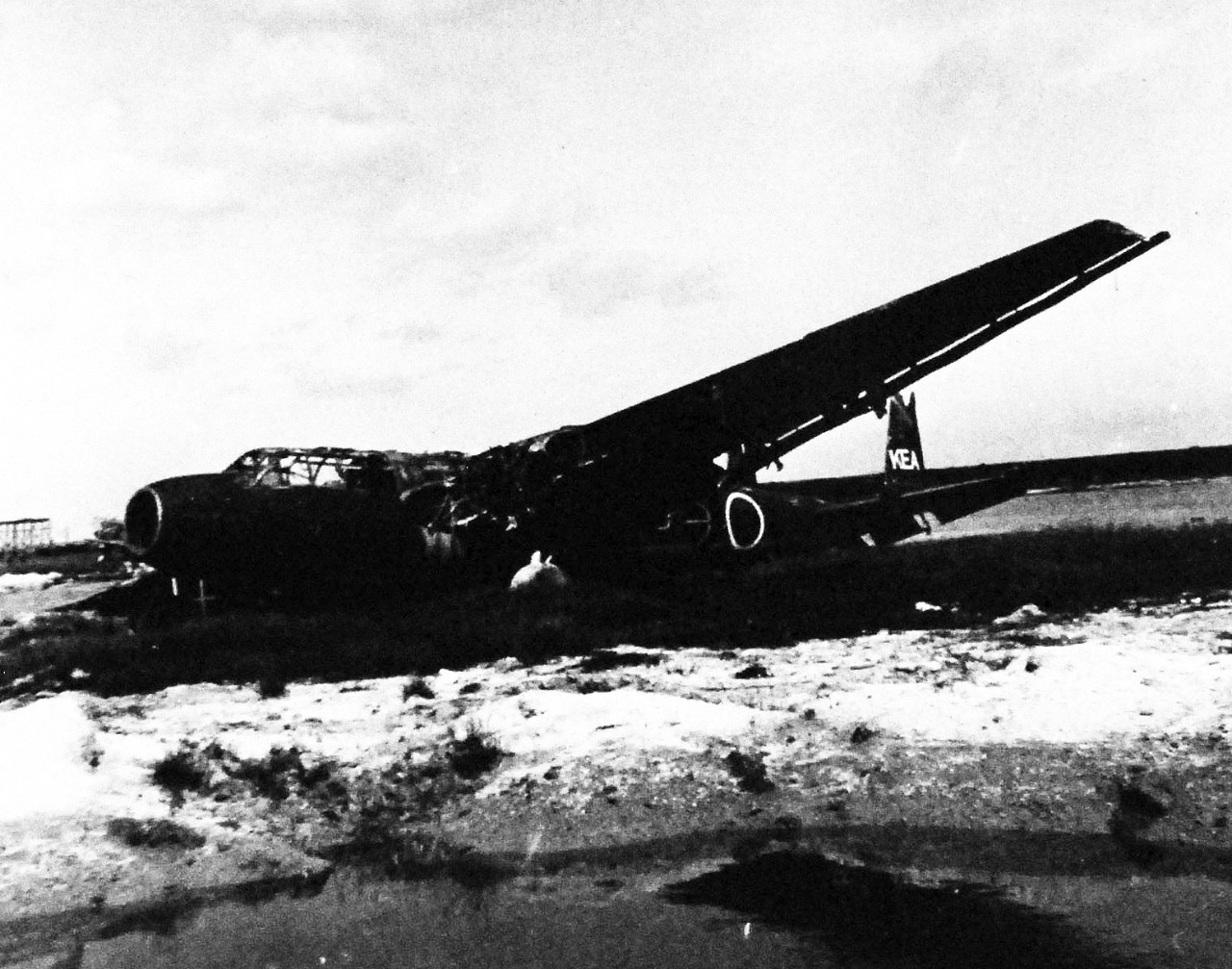 80-G-325332:  Okinawa Campaign, April-June 1945.  Group of smashed Japanese aircraft in the revetments of the airstrip at Naha, Okinawa, Ryukyu Islands.  This specific aircraft is a Kawasaki K-61, nicknamed “Tony”.     Photograph received 6 July 1945.  Official U.S. Navy Photograph, now in the collections of the National Archives.   (2014/5/1). 