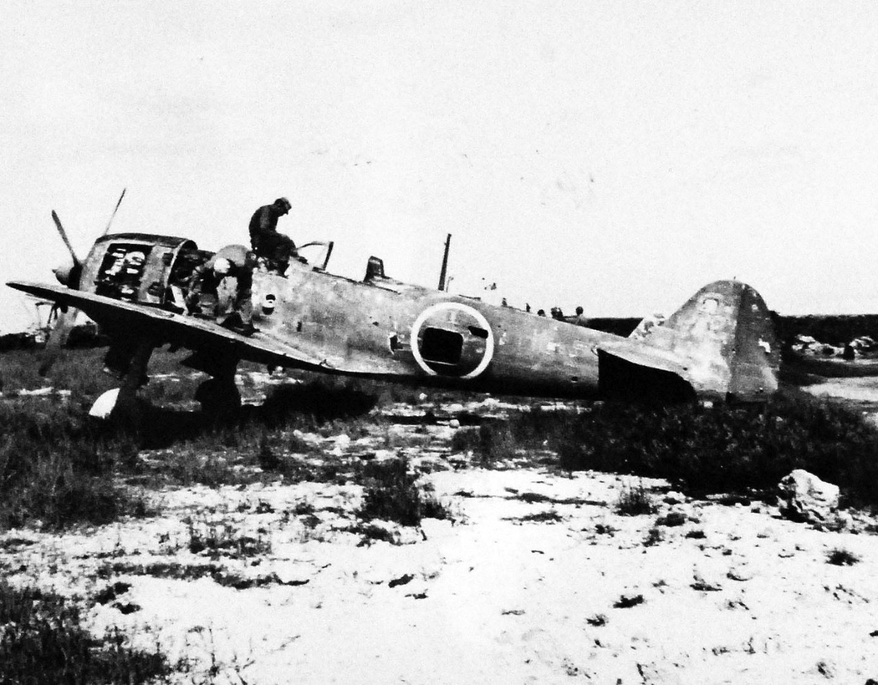 80-G-325333:  Okinawa Campaign, April-June 1945.  Group of smashed Japanese aircraft in the revetments of the airstrip at Naha, Okinawa, Ryukyu Islands.  This specific aircraft is a “Tony”.     This specific aircraft is a Kawasaki K-61, nicknamed “Tony”.     Photograph received 6 July 1945.  Official U.S. Navy Photograph, now in the collections of the National Archives.   (2014/5/1). 