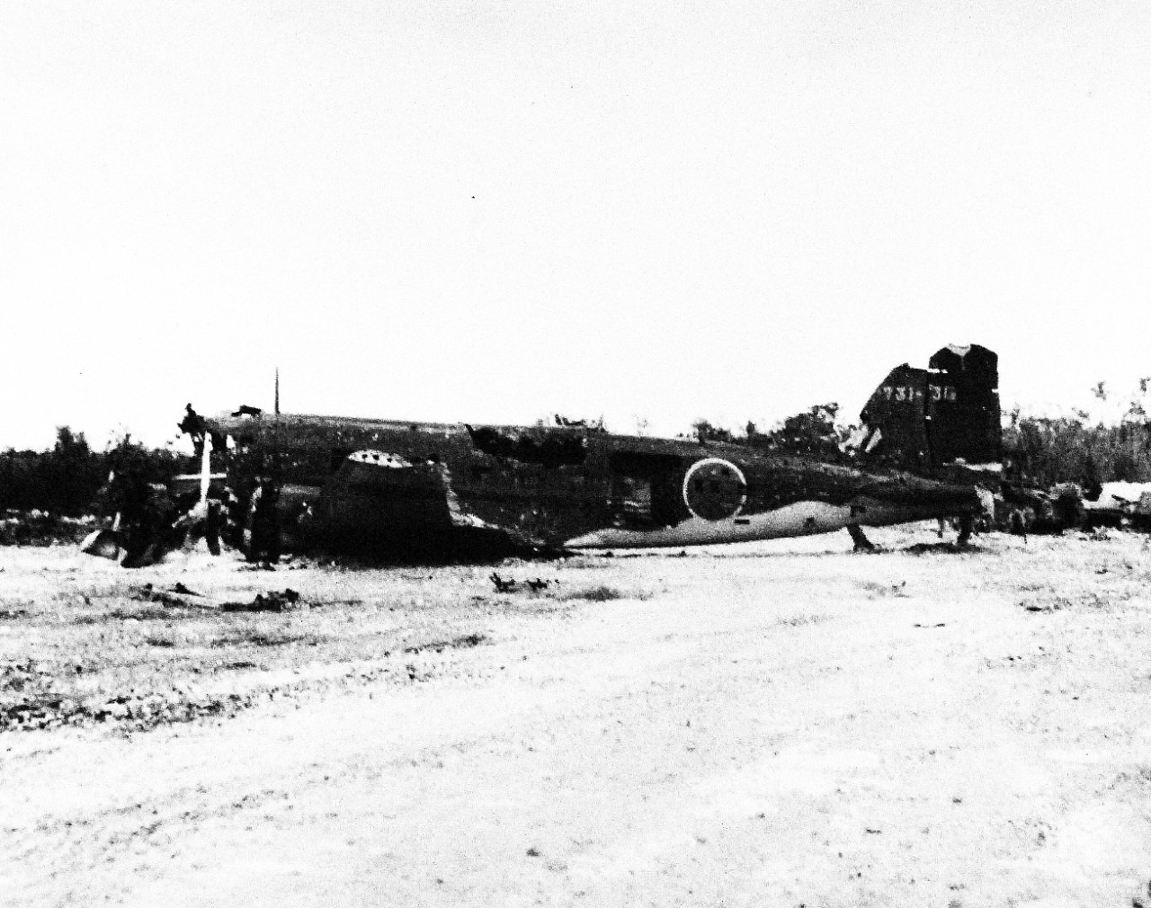 80-G-335011:   Okinawa Campaign, April-June 1945.  Wrecked Japanese transport Nakajima L2D, aircraft nicknamed “Tabby” on Okinawa, Ryukyu Islands.  Photograph received July 19, 1945.   Note, original mount card is extremely curved.  Official U.S. Navy Photograph, now in the collections of the National Archives.    (2015/4/21).  