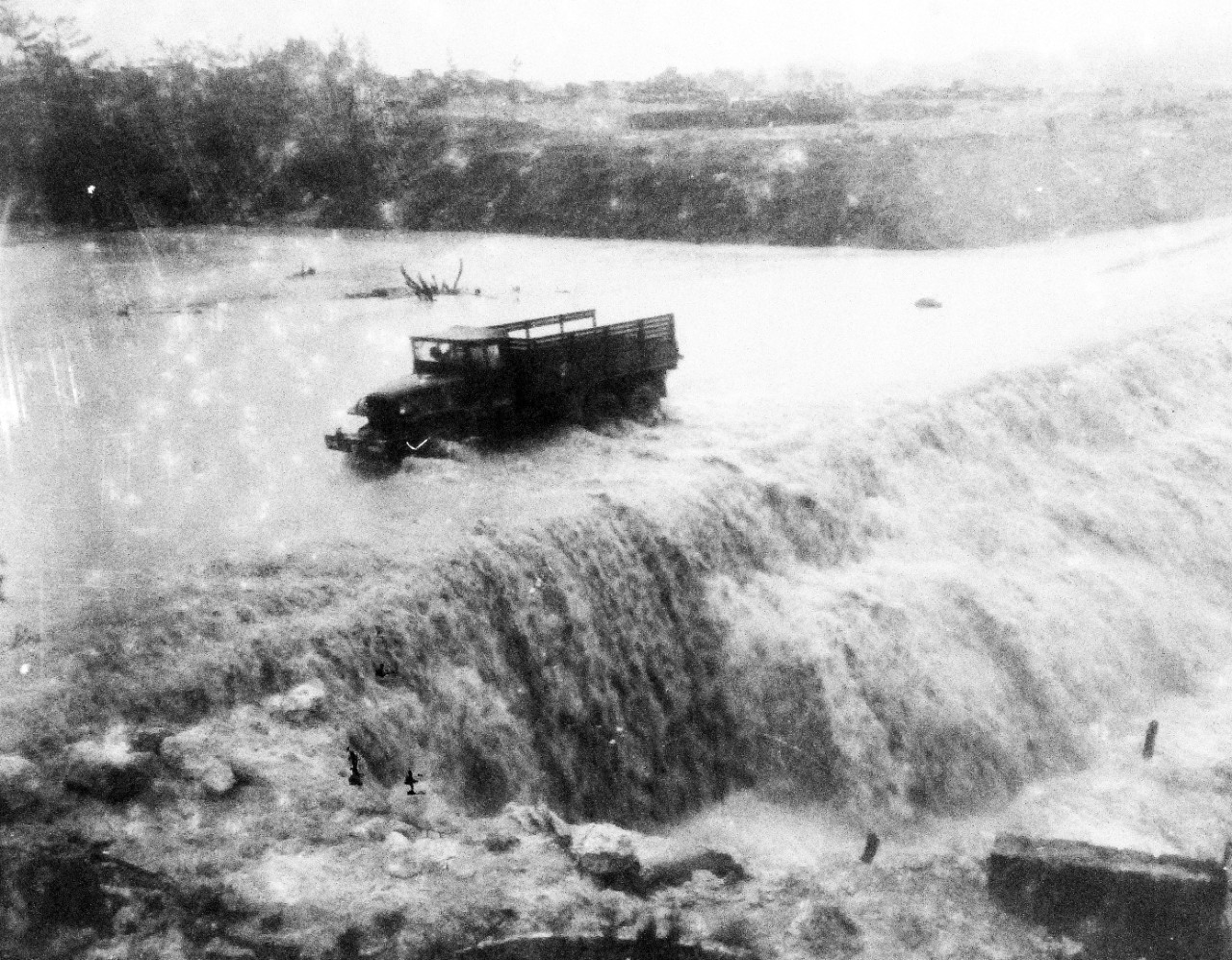 80-G-373432:  Okinawa Campaign, April-June 1945.  Marine Aviation Group Thirty-Three MAG-33 Headquarters under flooded condition at Okinawa, Ryukyu Islands, May 24, 1945.  Offical U.S. Navy Photograph, now in the collections of the National Archives. (2015/12/08).