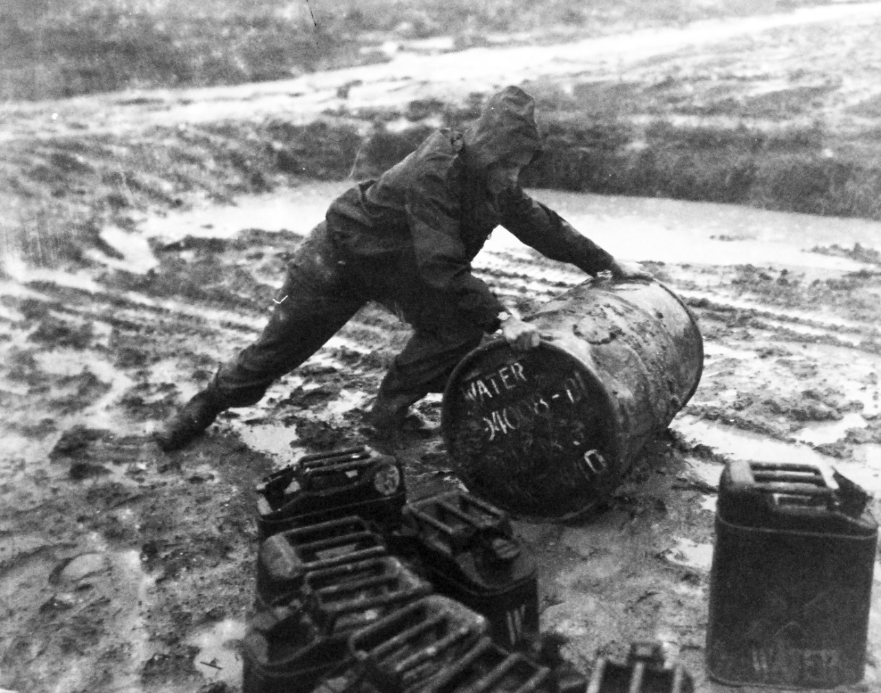 80-G-373433:  Okinawa Campaign, April-June 1945.  Marine Aviation Group Thirty-Three MAG-33 Headquarters under flooded condition at Okinawa, Ryukyu Islands, May 24, 1945.  Official U.S. Navy Photograph, now in the collections of the National Archives. (2015/12/08).