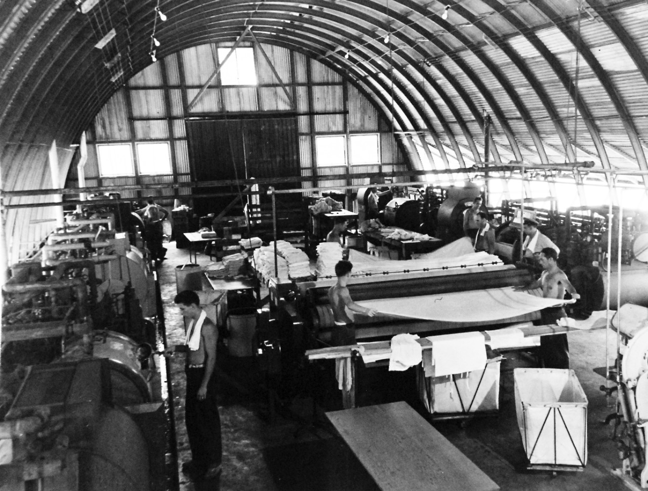 80-G-49585:  Okinawa Campaign, April-June 1945.  Laundry on Okinawa where two shifts of staff turn out 3500 lbs of linen every day giving patients the unaccustomed luxury of sleeping on sheets and mattresses for the first time in over a year.  Photograph received June 29, 1945.   Official U.S. Navy photograph, now in the collections of the National Archives.  (2017/01/10).