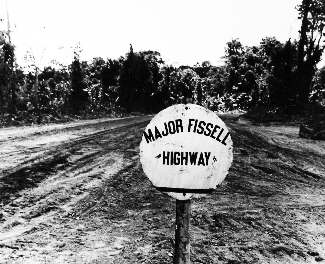 80-G-207831:  Bougainville Campaign, November 1943-August 1945.   This highway, hacked through the heavy Bougainville jungle, was dedicated to Marine Major Glenn Fisssell, who gave his life in an effort to rescue a wounded enlisted man during “The Coconut Grove Battle,” November 1943.  Photograph released January 14, 1944.   Official U.S. Navy photograph, now in the collections of the National Archives.  (2016/06/21).