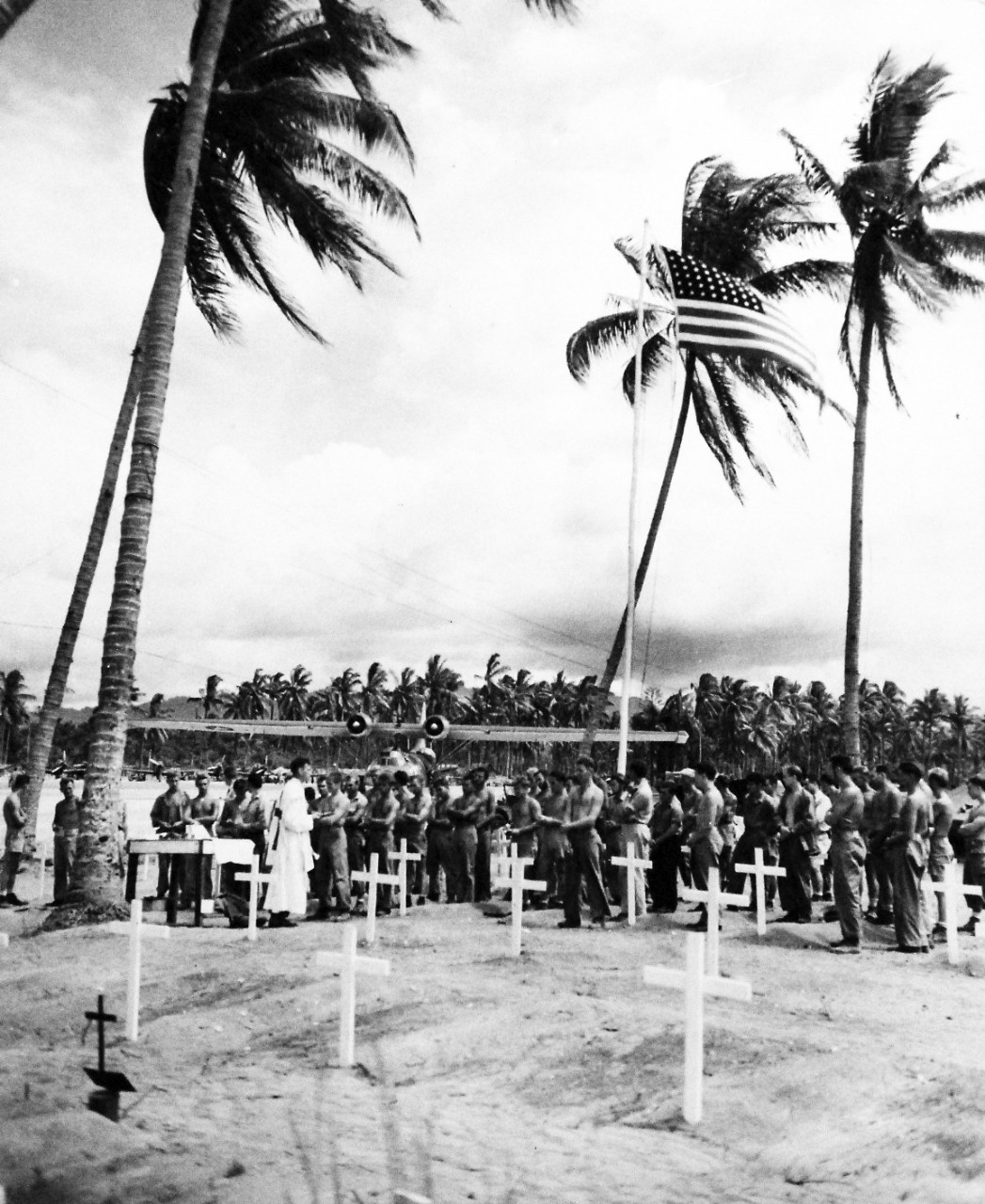80-G-207845:  Bougainville Campaign, November 1943-August 1945.   Men attend memorial services for their buddies, members of U.S. Marine Corps and U.S. Navy at cemetery at Bougainville in the Solomon Islands.     Photograph released January 12, 1944.    U.S. Navy photograph, now in the collections of the National Archives.  (2016/06/21).