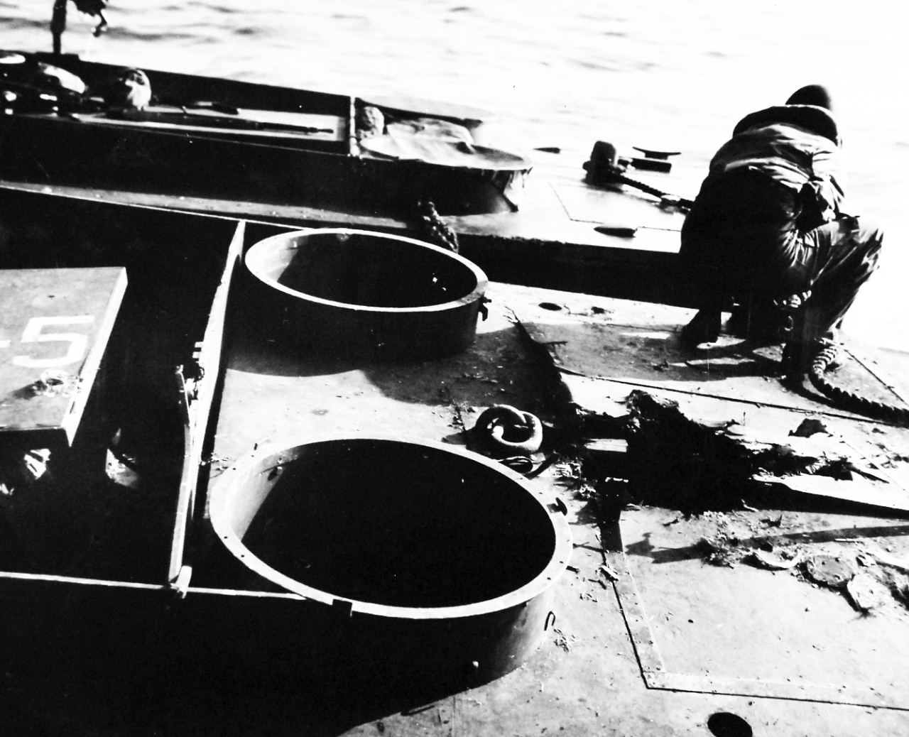 80-G-54389:  Bougainville Campaign, November 1943-August 1945.    Gaping holes marks entry of Japanese missile druing the U.S. attack.  The LCVPs are difficult targets, November 1, 1943.   U.S. Navy photograph, now in the collections of the National Archives.  (2016/06/28).