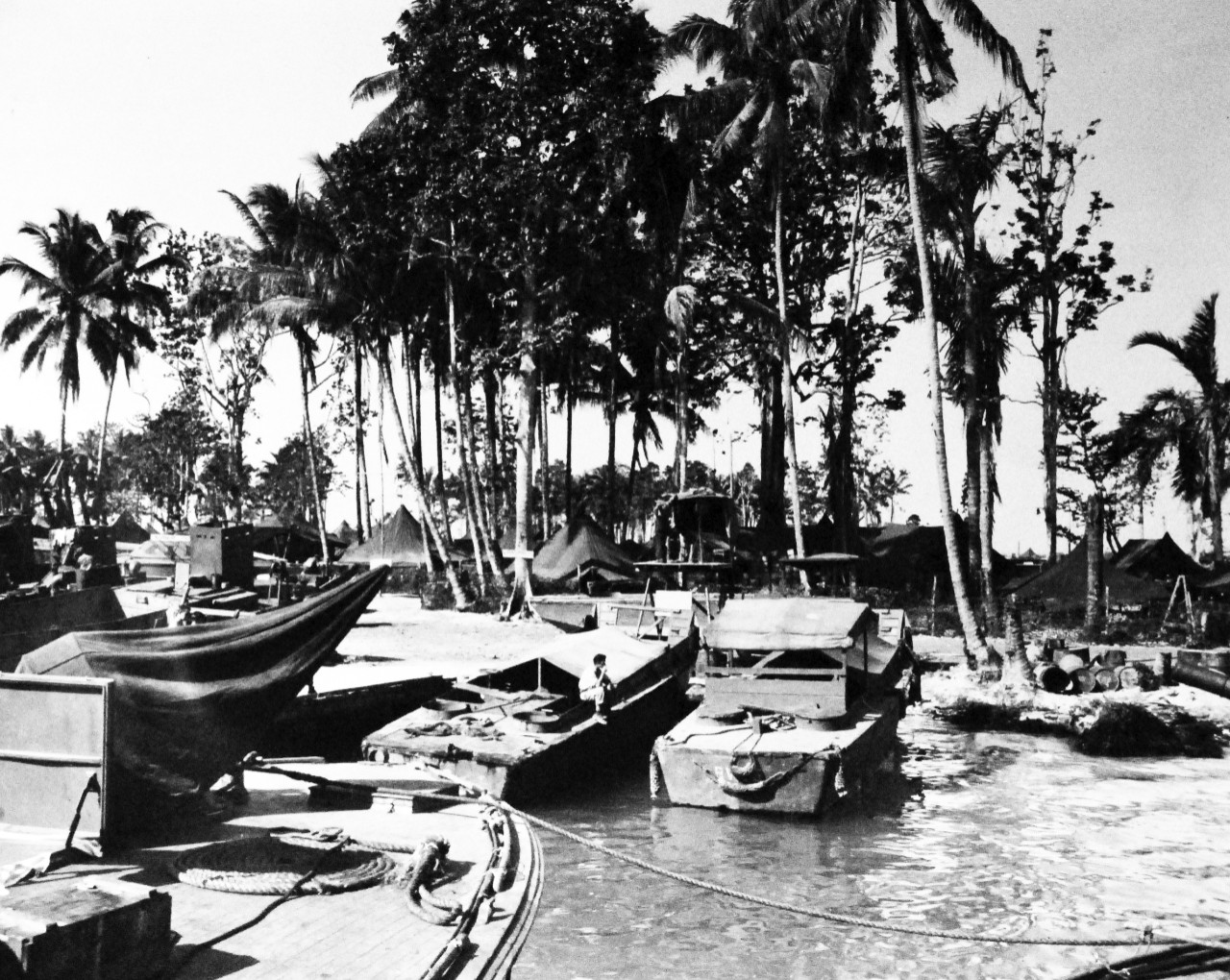 80-G-59330:   Bougainville Campaign, November 1943-August 1945.   U.S. Navy Motor Torpedo Base, Bougainville, Solomon Islands, 10 March 1944.  Bow of PT boat in left fore-ground.  Other boats are part of boat pool.  MTB base signal tower is in center.    Official U.S. Navy Photograph, now in the collections of the National Archives.   (2014/3/12). 