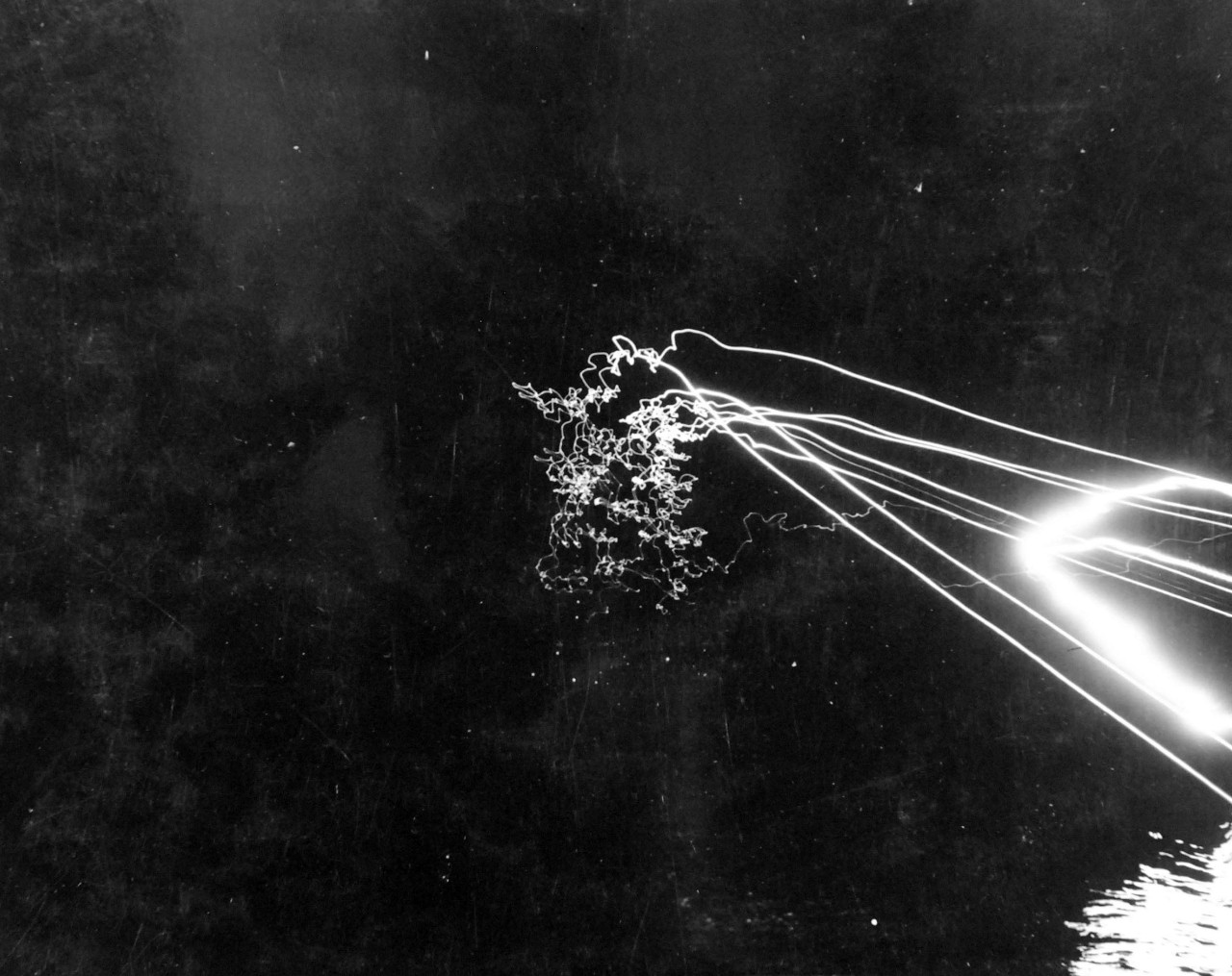 80-G-52861:  Battle of Kula Gulf, July 5-6, 1943.   Night-firing during the battle showing traces from guns.   Photographed from USS Honolulu (CL-48).  Official U.S. Navy Photograph, now in the collections of the National Archives.  (2018/04/04).  