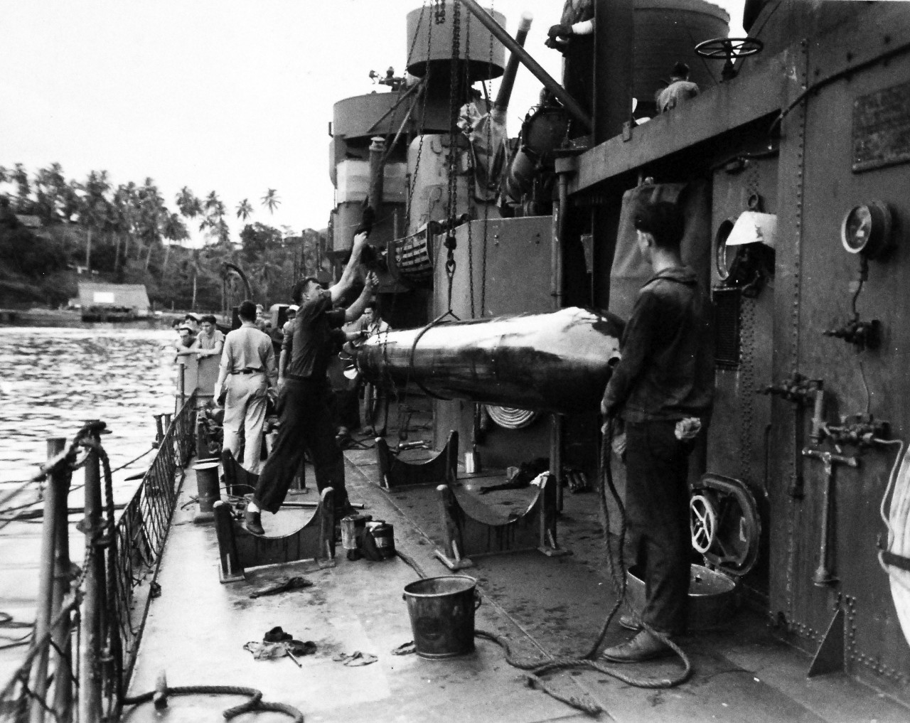 80-G-57599:  Battle of Kula Gulf, July 5-6, 1943.  Hoisting torpedoes on board USS Nicholas (DD-449) at Tulagi, after her others had been spent during the battle.   Photographed by CPU-2, July 12-13, 1943.  Official U.S. Navy Photograph, now in the collections of the National Archives.  (2016/6/2). 