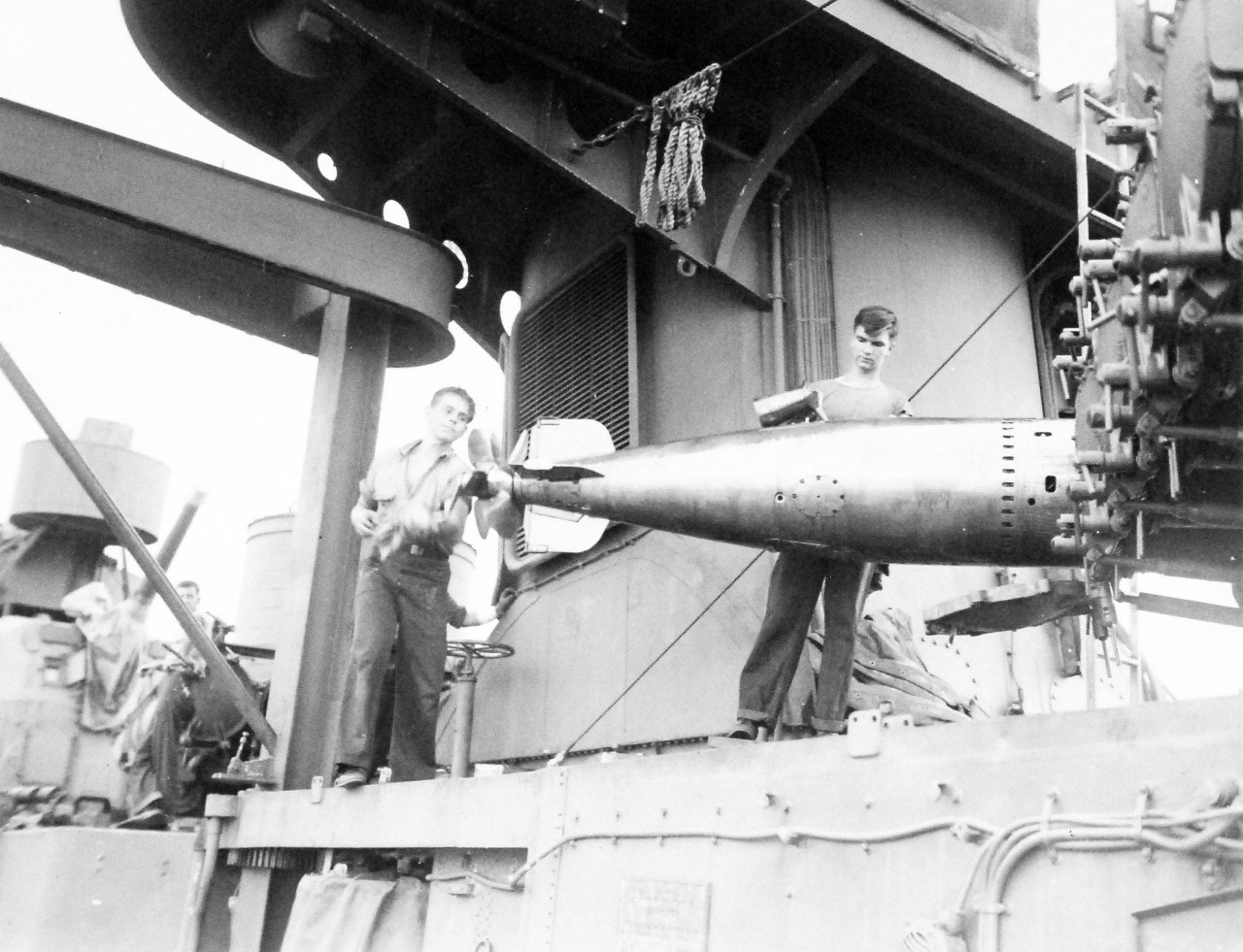 80-G-57602:  Battle of Kula Gulf, July -5-6, 1943.  Hoisting torpedoes on board USS Nicholas (DD-449) at Tulagi, after her others had been spent during the battle.   Photographed by CPU-2, July 12-13, 1943.   Official U.S. Navy Photograph, now in the collections of the National Archives.  (2016/6/2). 