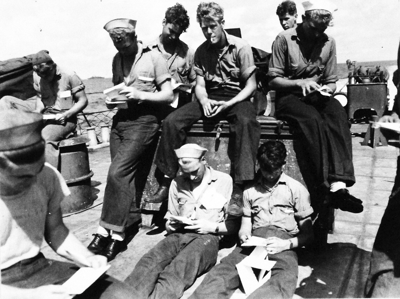 80-G-57619:  Battle of Kula Gulf, July 5-6, 1943.   Deck divisions receive mail on fantail of USS Nicholas (DD 449) after the battle.  Photographed by CPU-2, July 12-13 1943.  Official U.S. Navy Photograph, now in the collections of the National Archives.  (2016/6/2). 