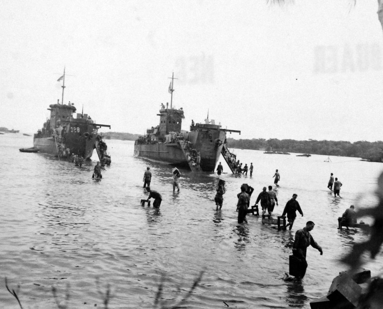 80-G-52629:  Rendova Island Invasion, June 30, 1943.   Troops during the invasion, transporting items from Landing Craft Infantry (Large),  LCI(L) 328 and LCI(L) 336.    Official U.S. Navy Photograph, now in the collections of the National Archives.  (2018/04/04).   
