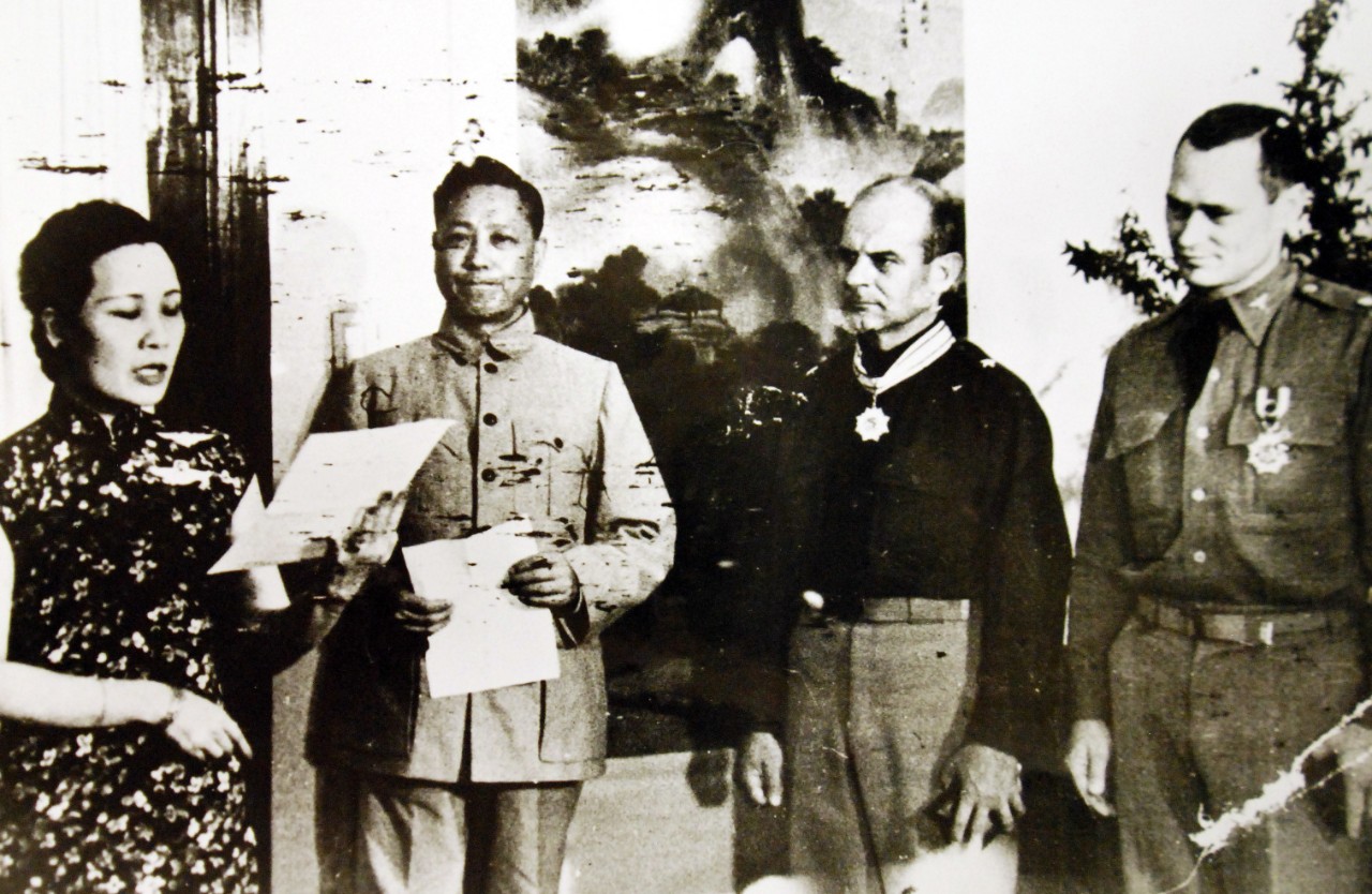 LC-Lot 11629-4:  Doolittle Raid on Japan, April 18, 1942.  Madame Chiang Kai-Shek reading the citation after presenting the military order of China to Brigadier General James H. Doolittle and Colonel John A. Hilger of the U.S. Army forces which bombed Tokyo, circa 1942.  Office of War Information Photograph, 409-ZC. Courtesy of the Library of Congress.     (2016/01/16).