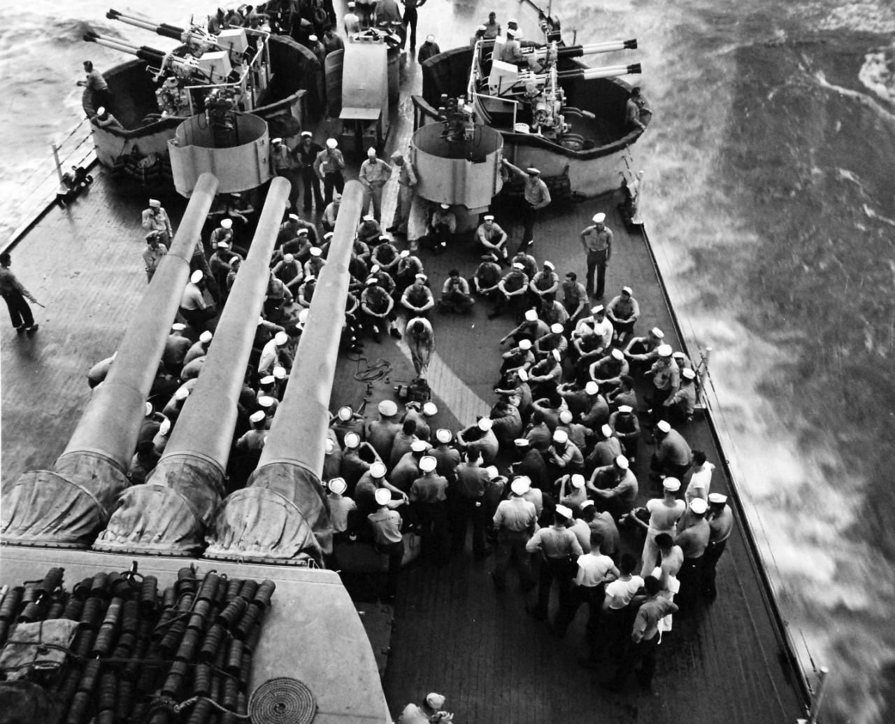 80-G-55256:   Wake Island Raid, October 5-6, 1943.    USS Minneapolis (CA 36), battle preparations are made, the morning of an attack on Wake Island, October 5, 1943.  The crew are assembled to be given instructions in flash-burn protection.   Photographed by CPU-7.  U.S. Navy photograph, now in the collections of the National Archives.  (2015/4/28).