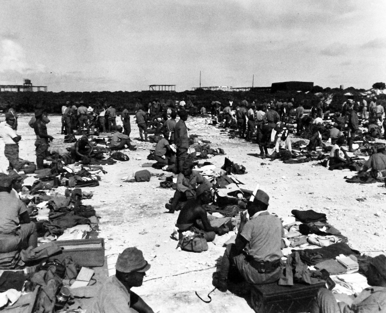 80-G-495799:  Surrender of Wake Island, September 1945.  Japanese await inspection of their gear before evacuation from Wake Island.  Photograph released 1 November 1945.  U.S. Navy photograph, now in the collections of the National Archives.   (2014/5/29).