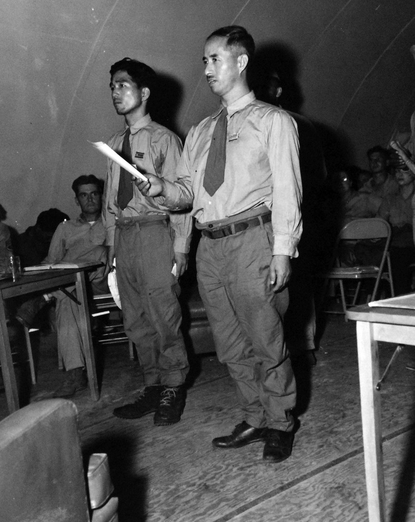 80-G-495958:   Surrender of Wake Island, September 1945.  A climactic moment in the war crimes trial of two Japanese officers from Wake Island.  Here stands Lieutenant Soichi Tachibana and Rear Admiral Shigematsu Sakaibara, both convicted and sentenced to hang for the murder of 98 American civilians on Wake Island in October 1943.   Sakaibara is shown reading a final statement in his own behalf before sentence is pronounced at Kwajalein Island in the Marshall Islands.   Photograph released 27 December 1945.   U.S. Navy photograph, now in the collections of the National Archives.   (2014/5/29).   (Here due to relevance to Wake Island).