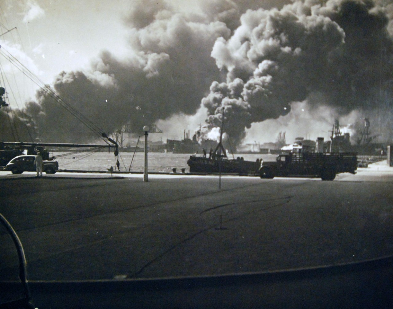 <p>80-G-32577: Japanese Attack on Pearl Harbor, December 7, 1941. Burning of the forward magazines of USS Shaw (DD-373), in the floating drydock YFD-2, after a bombing attack by Japanese planes.&nbsp;</p>

