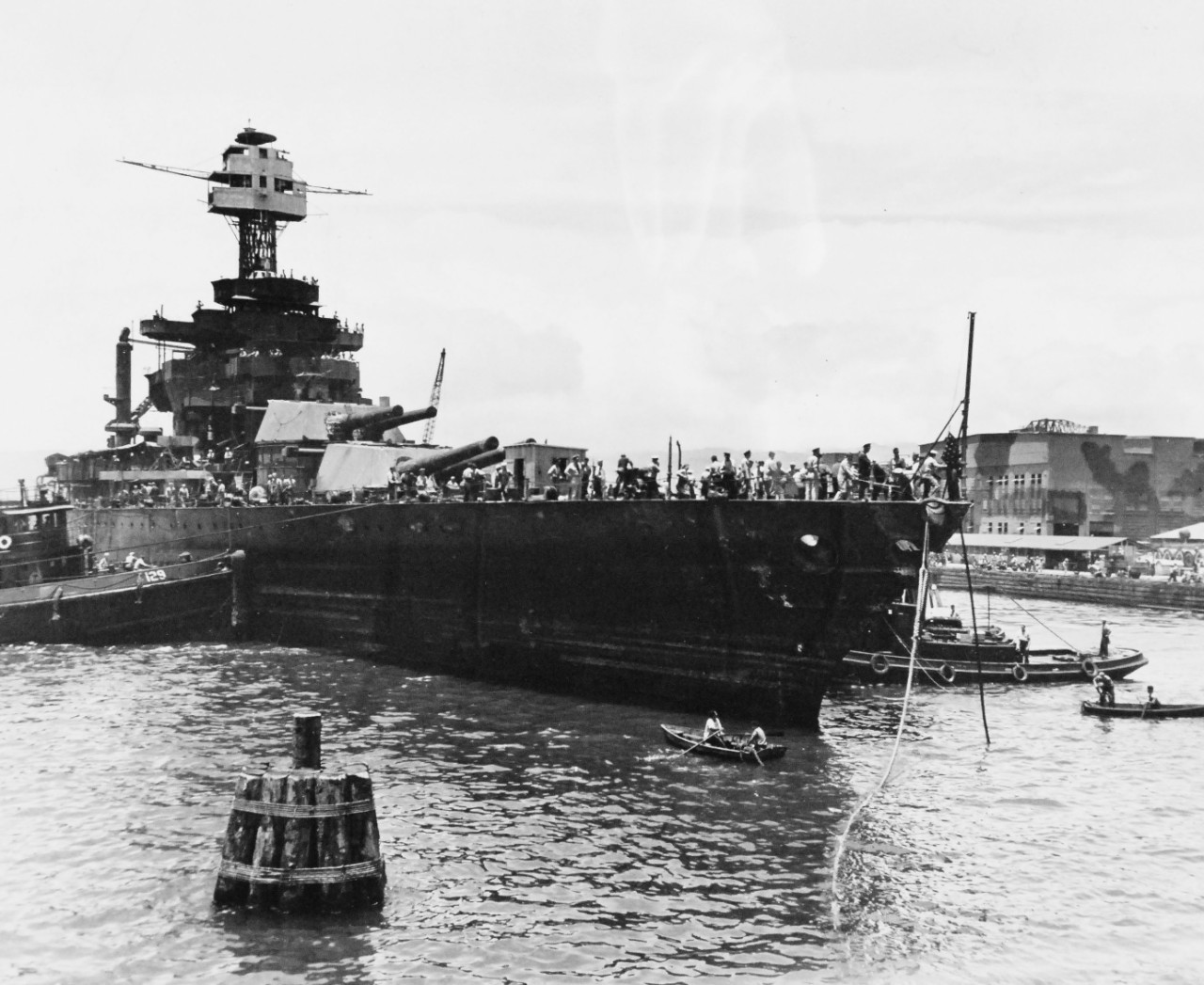 <p>80-G-19934: Japanese Attack on Pearl Harbor, Territory of Hawaii, 7 December 1941. USS West Virginia (BB 48), sunk at her berth by Japanese torpedoes and bombs, was sufficiently raised to drydock.&nbsp;</p>
