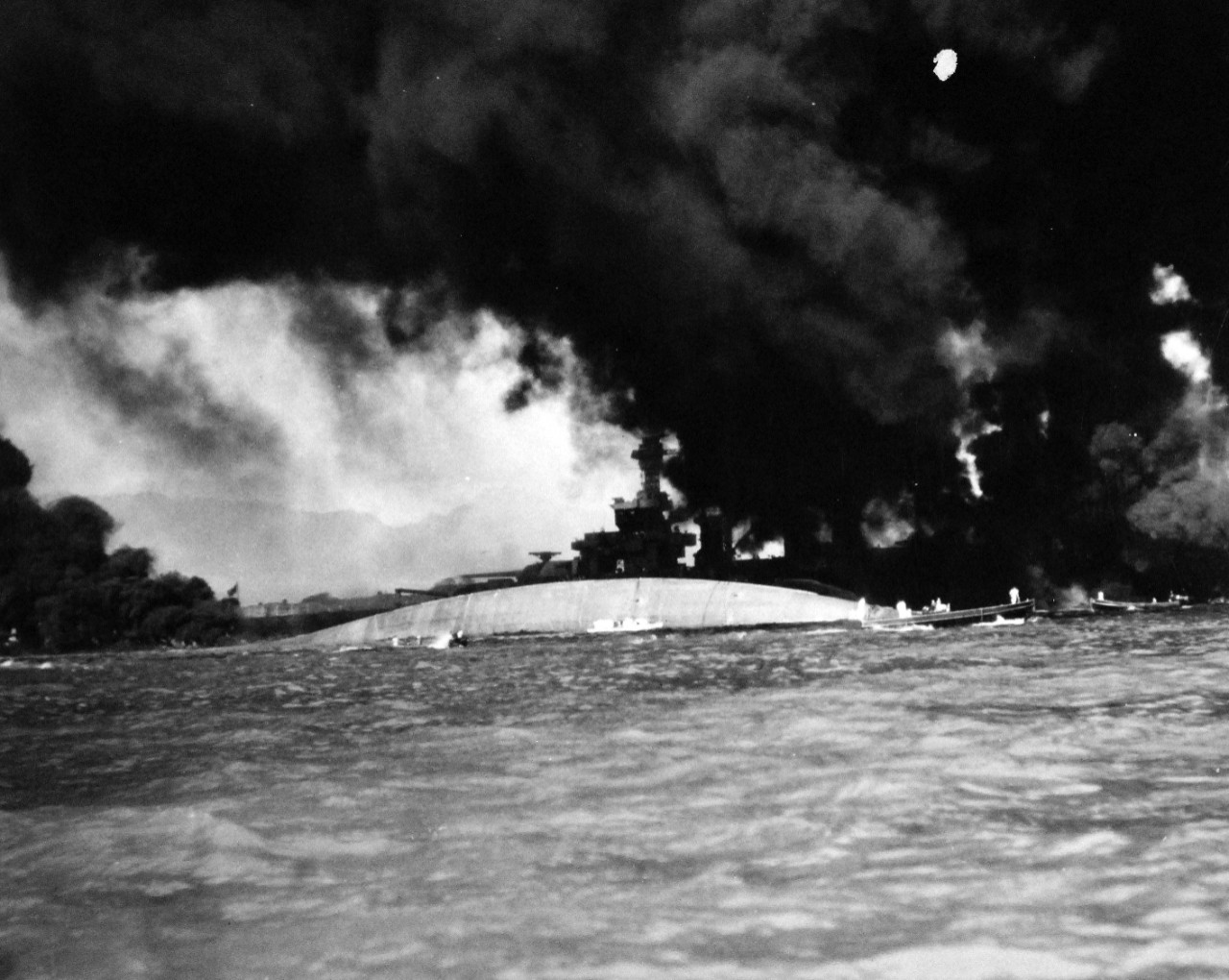 80-G-32415:  Japanese Attack on Pearl Harbor, December 7, 1941.   Capsized USS Oklahoma (BB 37) and USS Maryland (BB 46) after the attack. O fficial U.S. Navy photograph, now in the collections of the National Archives.   Official U.S. Navy photograph, now in the collections of the National Archives.  (9/15/15).