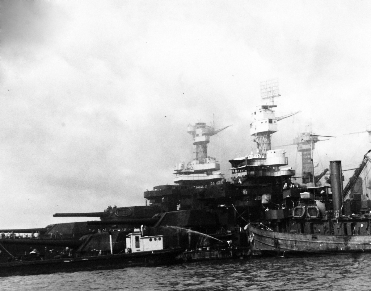 80-G-32475:  Japanese Attack on Pearl Harbor, December 7, 1941.  USS West Virginia (BB 46) and USS Tennessee (BB 43) after the attack.  Official U.S. Navy photograph, now in the collections of the National Archives.  (9/15/15).