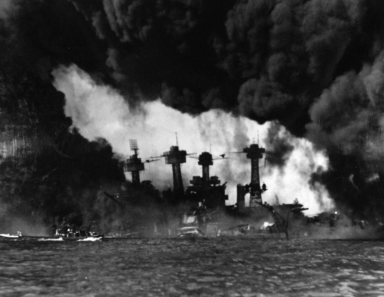80-G-32725:  Japanese Attack on Pearl Harbor, December 7, 1941.  USS West Virginia (BB 48) and USS Tennessee (BB 43) are shown after the attack.  Official U.S. Navy photograph, now in the collections of the National Archives.   (9/9/2015).