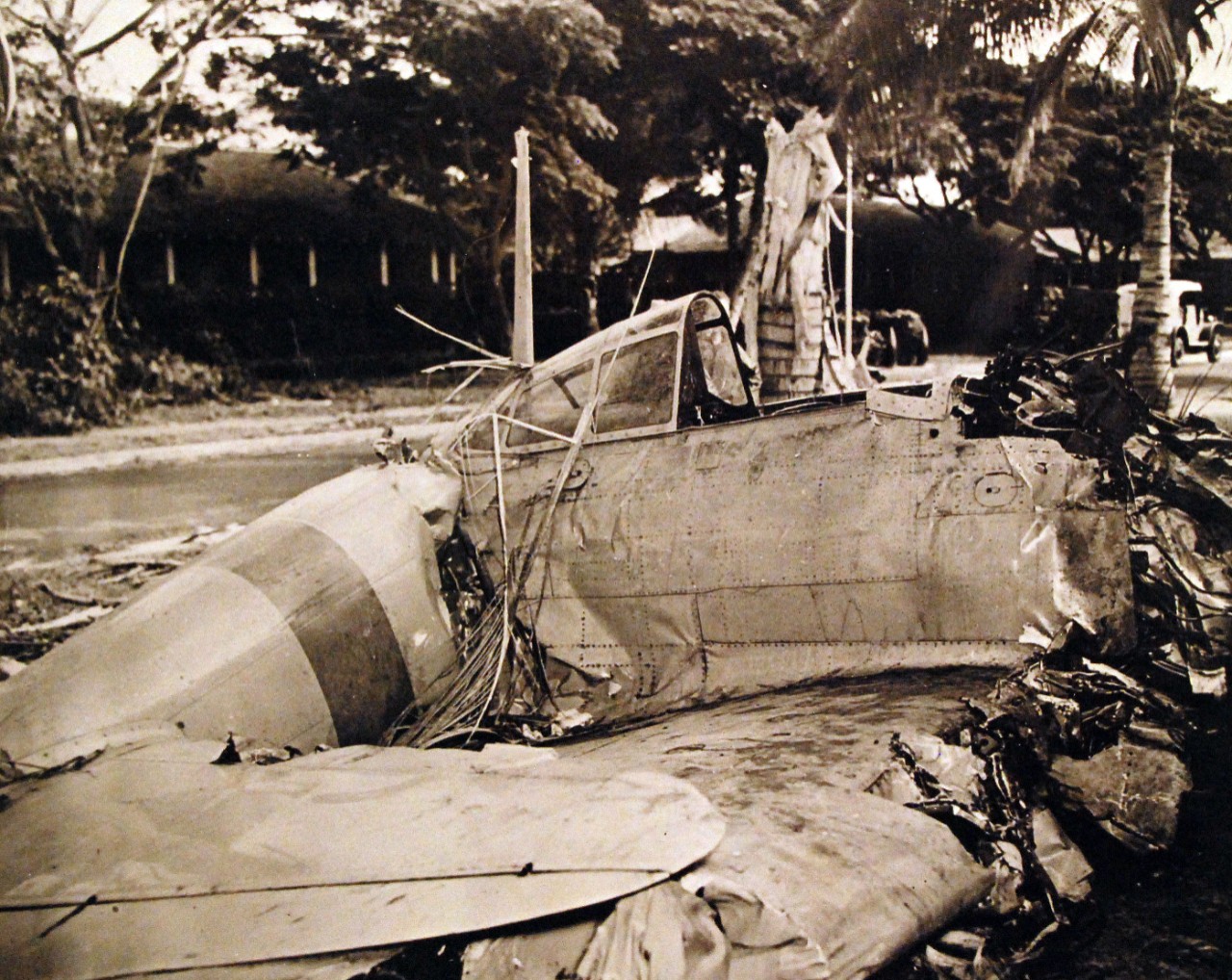 80-G-13040:  Japanese Attack, Pearl Harbor, December 7, 1941.   Mitsubishi A6M2 “Zero” from Japanese aircraft carrier Akagi shot down during the attack.  Official U.S. Navy Photograph, now in the collections of the National Archives. (9/29/2015).