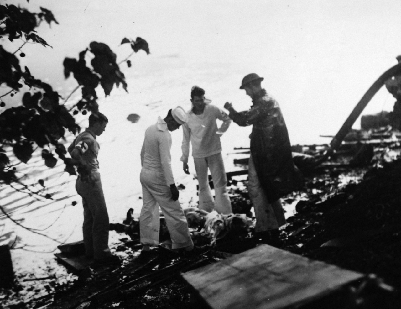 80-G-32552:   Japanese Attack on Pearl Harbor, December 7, 1941.   Shattered remains of a Japanese VAL pilot, whose plane was brought down during the Japanese raid.   The crash is at Reckoning Point.    Official U.S. Navy photograph, now in the collections of the National Archives.     (7/2/2014).