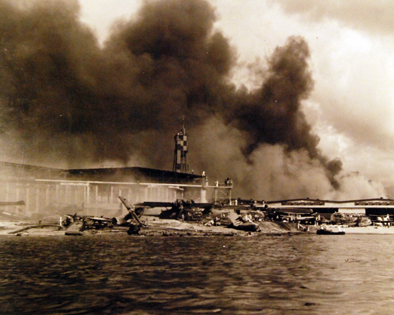 80-G-32744:   Japanese Attack on Pearl Harbor, December 7, 1941.    Damaged planes are shown after the attack. Official U.S. Navy photograph, now in the collections of the National Archives.  (9/9/2015).