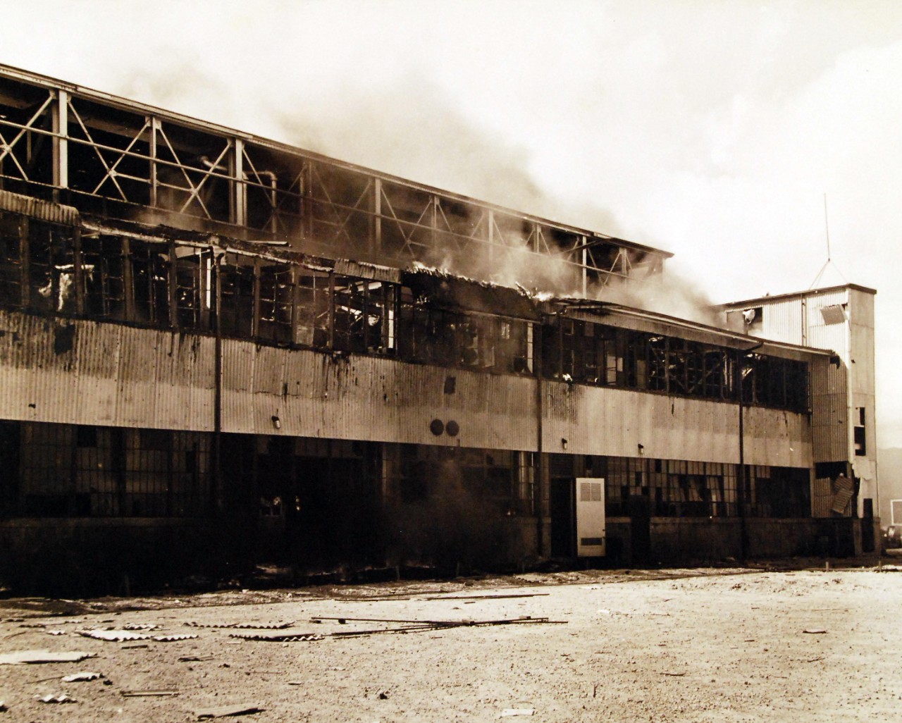 80-G-77651:   Japanese Attack on Pearl Harbor Attack, 7 December 1941.  Smoldering U.S. Navy Hangar at Naval Air Station, Kaneohe Bay, Oahu, after the Japanese attack.  U.S. Navy photograph, now in the collections of the National Archives. (3/4/2015).