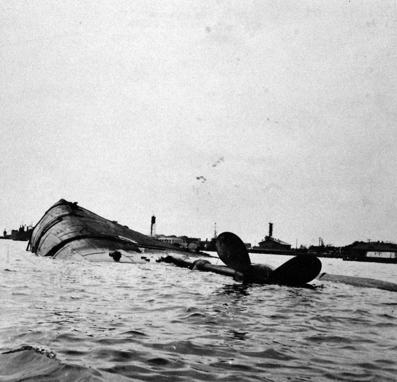 80-G-182699:  Japanese Attack on Pearl Harbor Attack, 7 December 1941 Japanese Attack on Pearl Harbor, December 7, 1941.   The capsized USS Oklahoma (BB 37) is shown after the attack. U.S. Navy photograph, now in the collections of the National Archives (9/9/2015).
