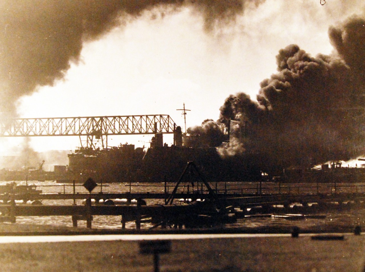 80-G-32775:   Japanese Attack on Pearl Harbor, December 7, 1941.   Ships burning after the attack. Official U.S. Navy photograph, now in the collections of the National Archives. (9/9/2015).