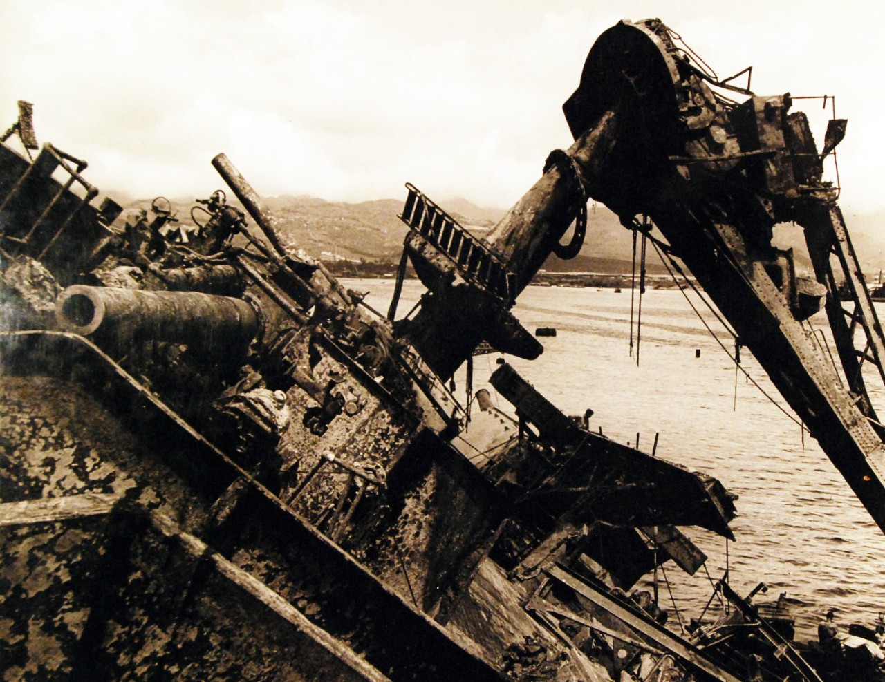 80-G-41616:  Pearl Harbor Attack, December 7, 1941.      Damaged USS Oklahoma (BB-37) raised after capsizing.  Shown:  Corrosion on superstructure.     Photograph released May 23, 1943.  Official U.S. Navy Photograph, now in the collections of the National Archives. (2016/10/11).    
