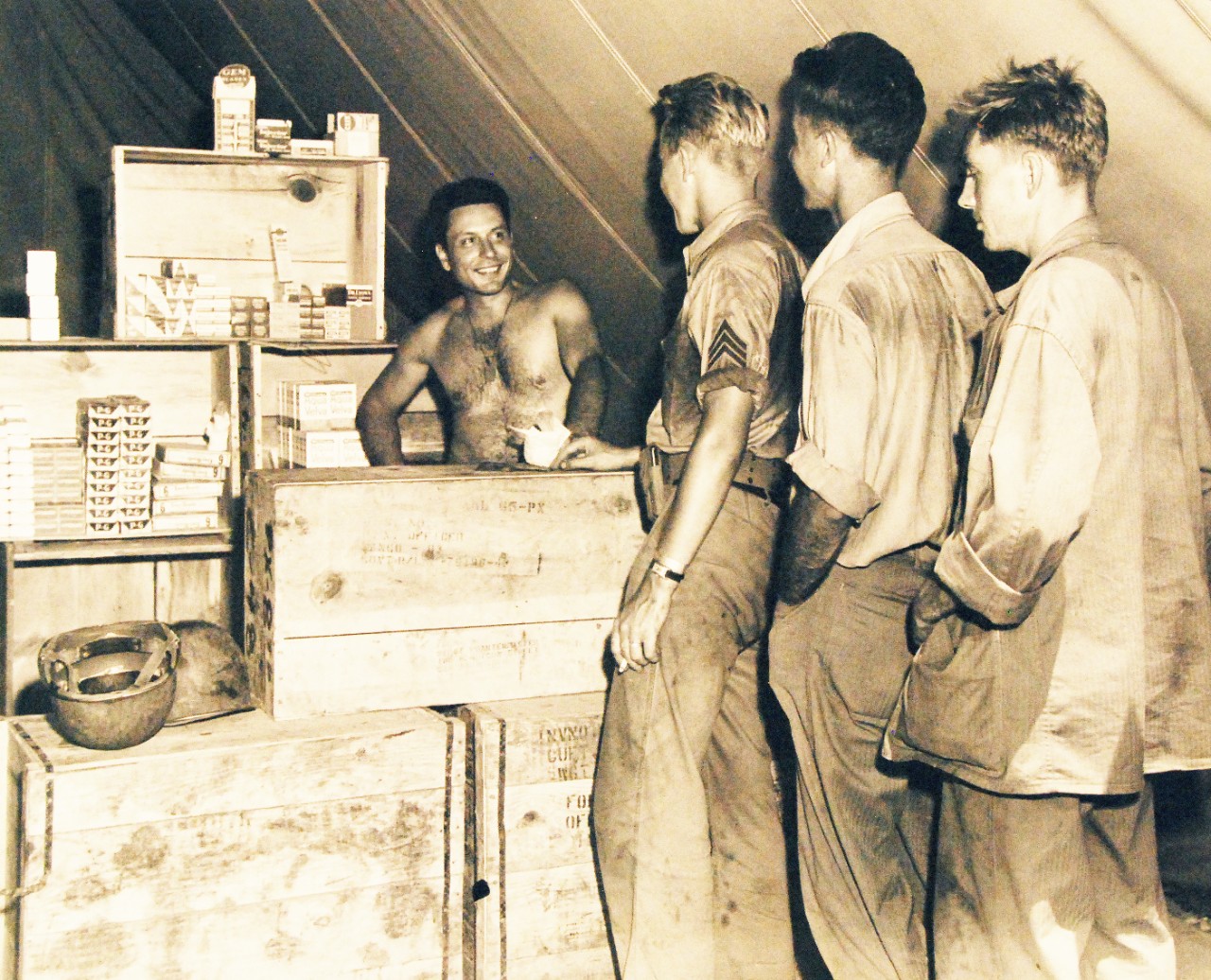 80-G-40266:  Guadalcanal Operation, August 1942-February 1943  In this tented store somewhere in the Pacific, U.S. Marine fighters buy razor blades, soap, shaving accessories, and toothpaste, all made in the U.S.A., January 11, 1943.   Possibly Guadalcanal.   U.S. Navy Photograph, now in the collections of the National Archives (2015/10/20).