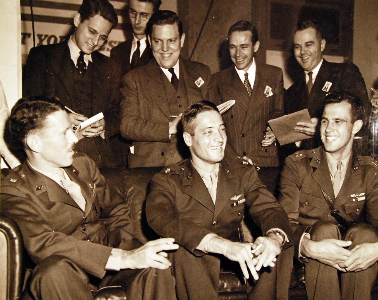 80-G-41220:  Lieutenant Colonel Richard C. Mangum, Major John L. Smith (Medal of Honor recipient), and Captain Marion R. Carl, all USMC, are seated left to right at a press conference in the Navy Department, Washington, D.C., shortly after their return from Guadalcanal, May 1943.  Smith received the Medal of Honor for his actions during August 21 to September 15, when he shot down 16 enemy planes, contributing to Japan’s inability to drive U.S. forces from Guadalcanal.   .   Official U.S. Navy photograph, now in the collections of the National Archives.    (2014/6/12).
