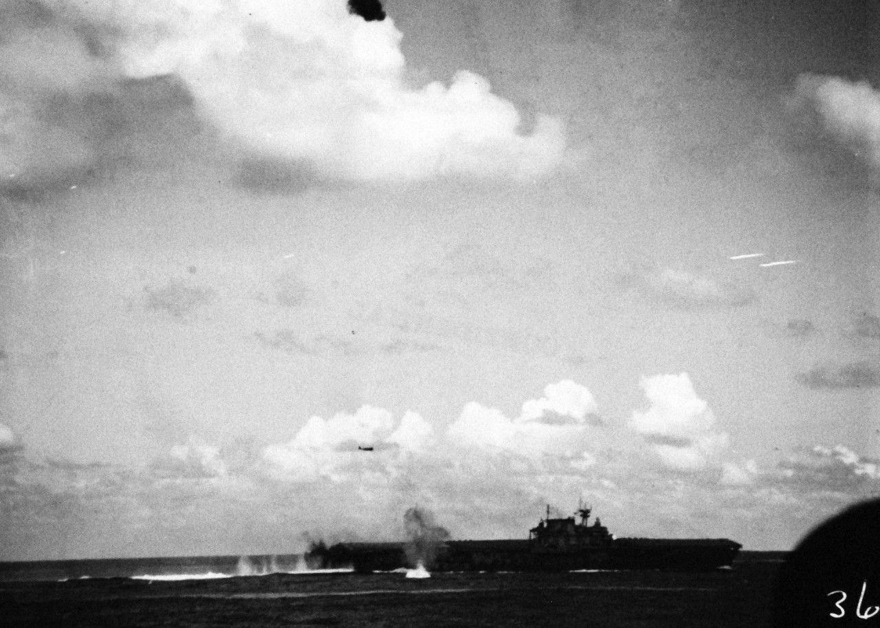 80-G-33946:  Battle of Santa Cruz Islands,  26 October 1942.   Sinking of USS Hornet (CV 8) by attacks from Japanese Nakajima B5N “Kate” torpedo bomber.  Photographed from USS Pensacola (CA 24).  U.S. Navy photograph, now in the collections of the National Archives.  (2015/11/17).