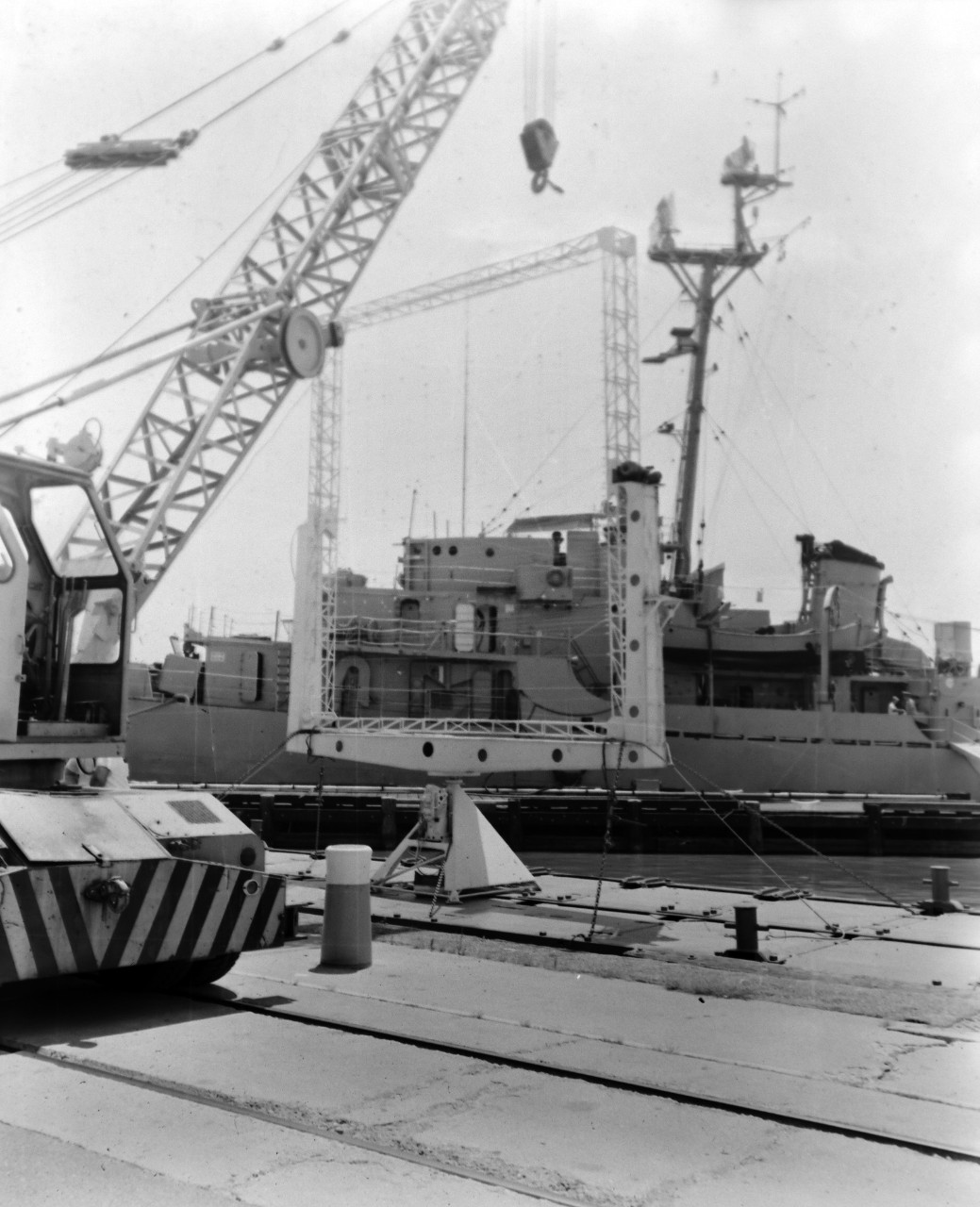 NMUSN-1010:   XAF Radar Antenna, 1960s.   Being delivered to the Washington Navy Yard for display.  Note the U.S. Navy tug alongside a small thin barge carrying the radar antenna.  This radar was the first shipboard radar to be installed onboard a U.S. Navy ship, USS New York (BB-34).  Surviving World War II, it was brought to the Washington Navy Yard where it was on exterior display until the mid-1980s where it was placed into storage.   Following conservation, the radar is now on display at the National Electronics Museum, Linthicum, Maryland.    Original is a black and white negative.   National Museum of the U.S. Navy Photograph Collection.