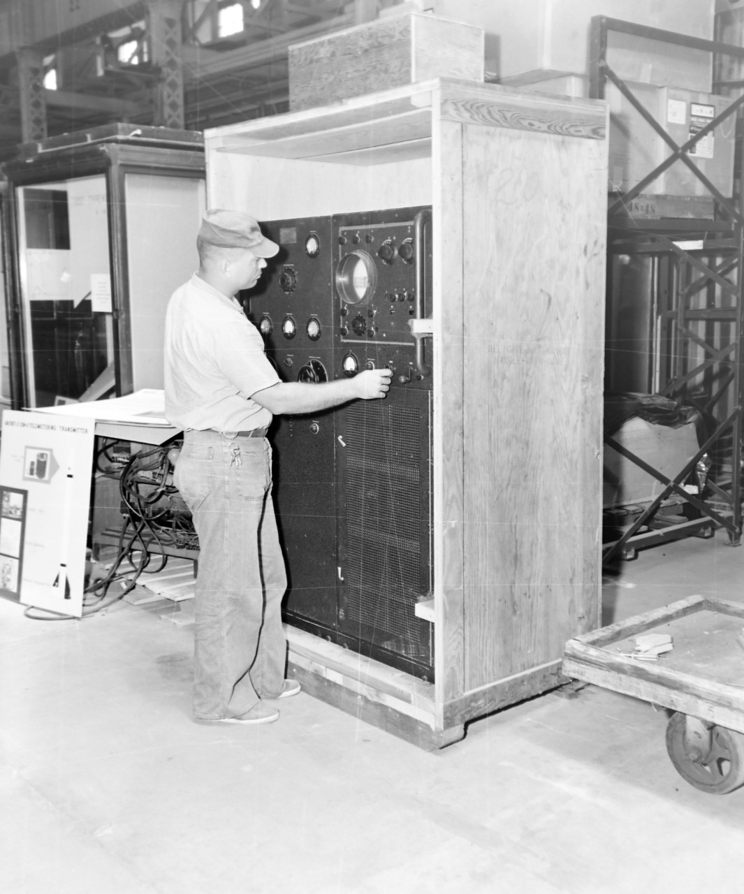 NMUSN-1022:   XAF Radar Receiver, 1960s.  Technician works on the receiver and transmitter after arriving at the Naval Historical Display Center for display.   The radar was developed by the Naval Research Laboratory.     Original is a black and white negative.   National Museum of the U.S. Navy Photograph Collection.