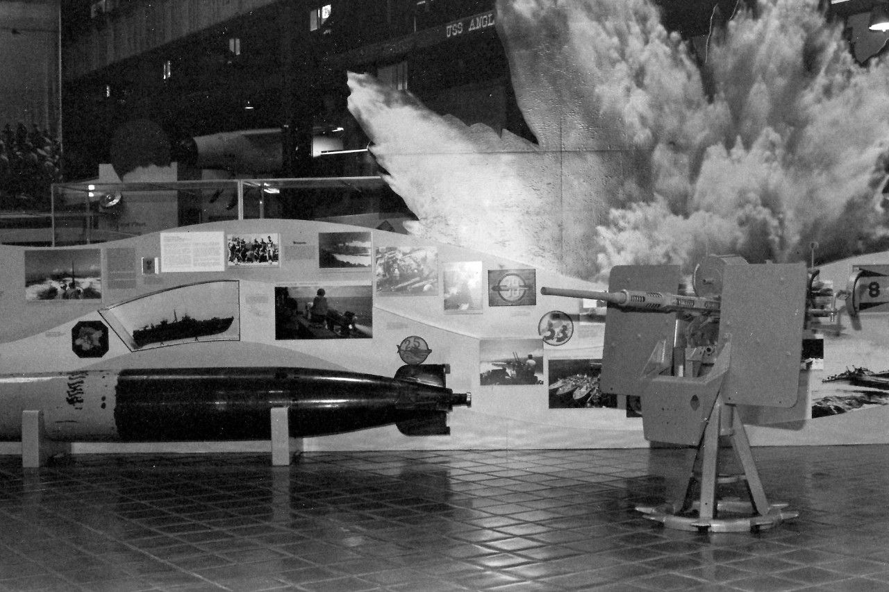 NMUSN-382: In Harm’s Way Exhibit Area, late 1980s. This photograph shows the Torpedo Boat Area of the Pacific section, and the 20mm anti-aircraft gun. National Museum of the U.S. Navy Photograph Collection.