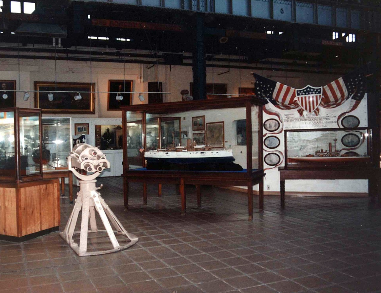 NMUSN-3745: Spanish-American War Exhibit, 1990s. Front of exhibit showing the Hotchkiss Gun. National Museum of the U.S. Navy Photograph Collection.