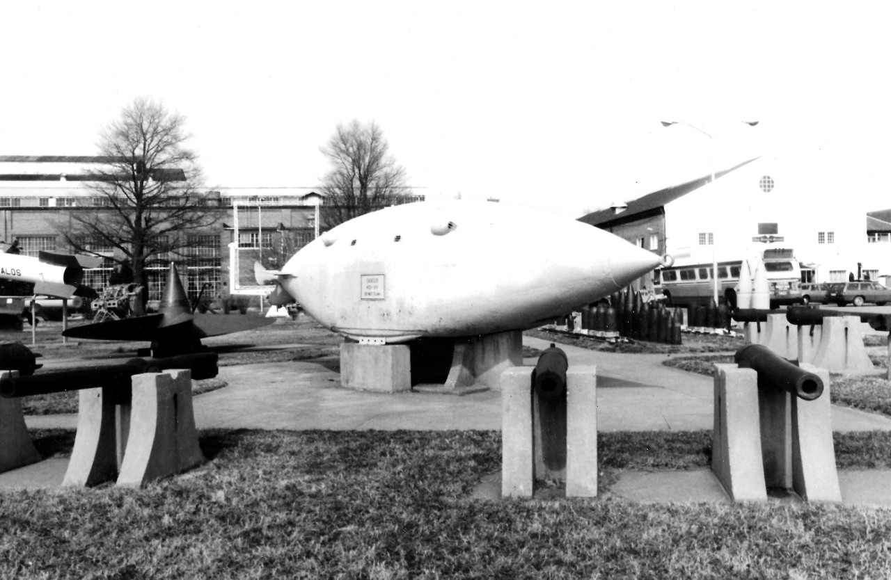 NMUSN-149:   Willard Park, Washington Navy Yard, Washington, D.C. 1970s.  View looking north.   Submersible Intelligent Whale is in the center.  The National Museum of the U.S. Navy is to the right.  National Museum of the U.S. Navy Photograph Collection.   