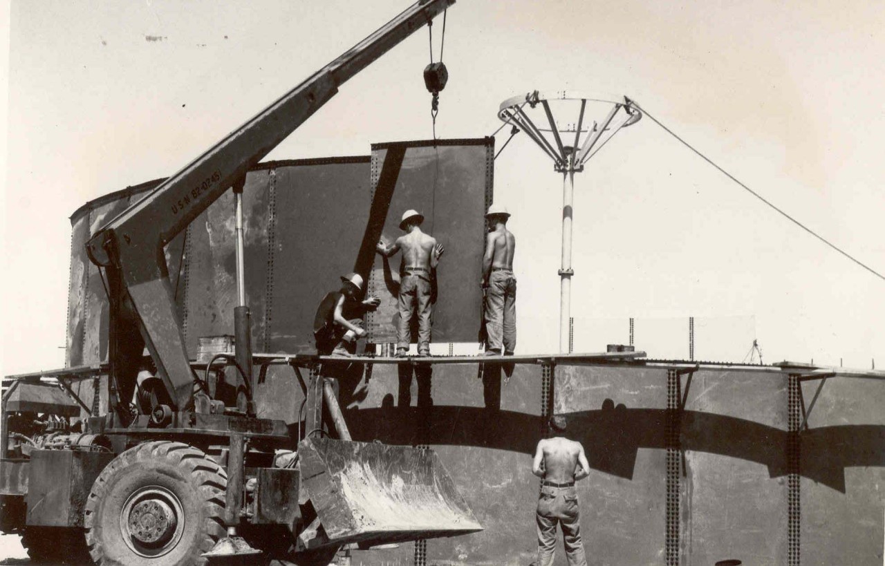 Seabees from an unknown Naval Mobile Construction Battalion erecting walls around a reservoir tank on at the beach of Chu Lai in Quảng Nam Province, Vietnam. 